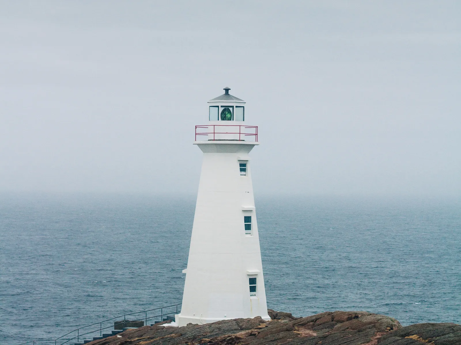 a lighthouse on a rocky shore