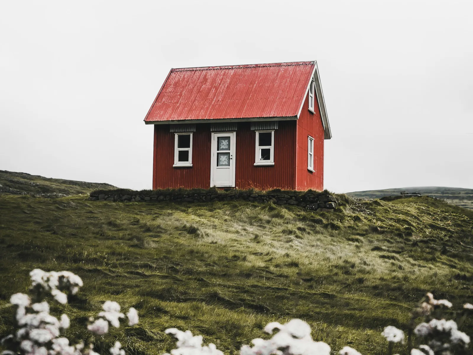 a red house on a hill