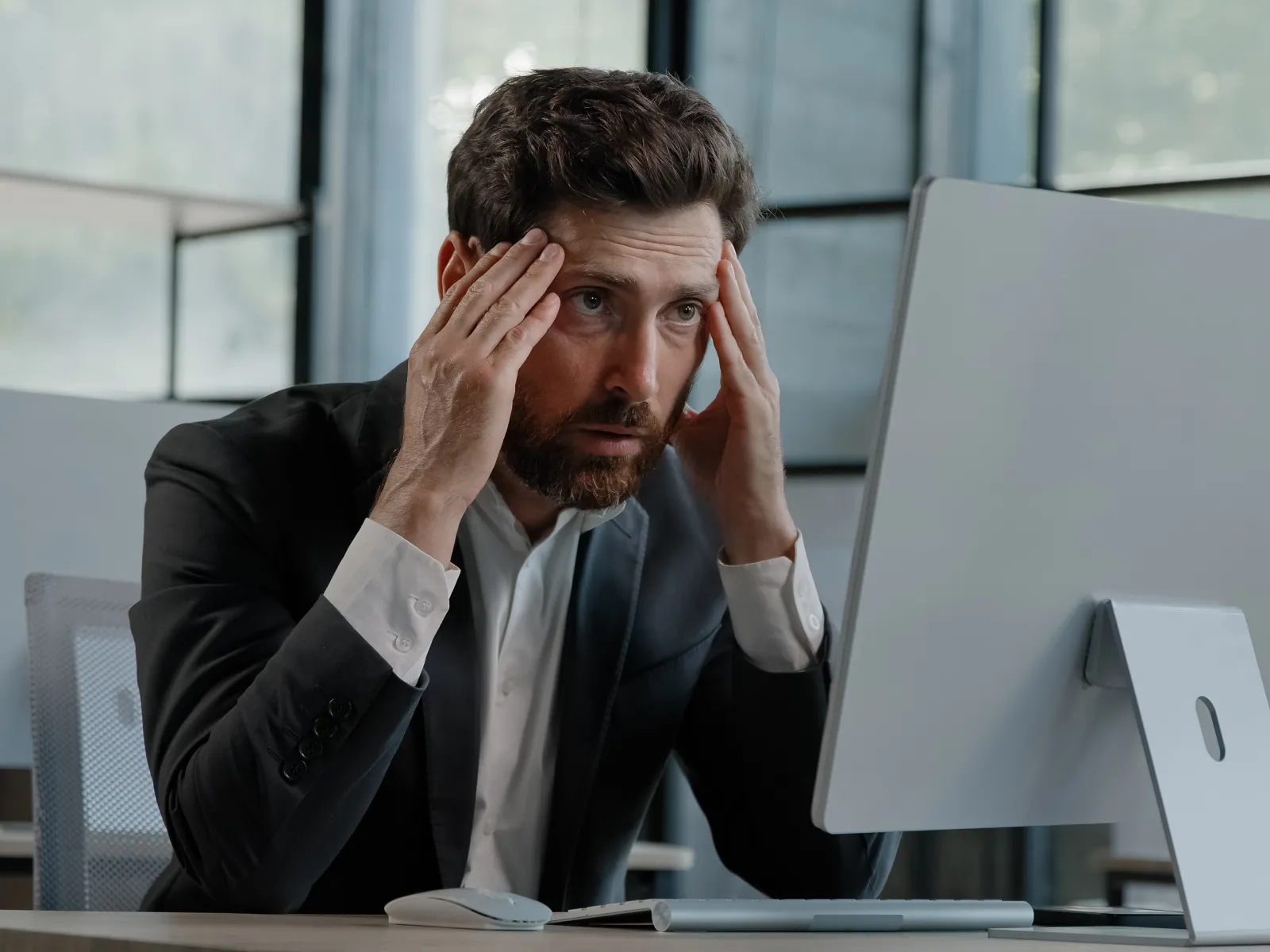 a man holding his head