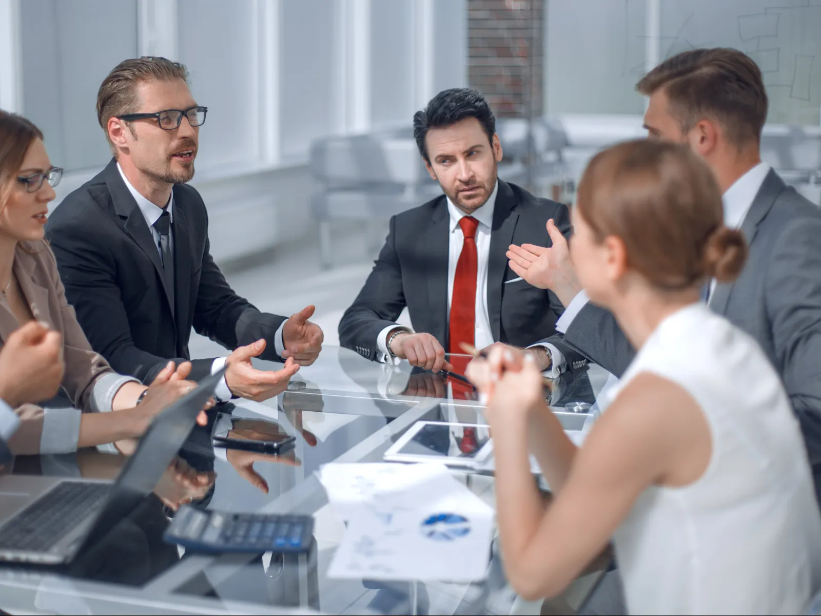 a group of people sitting around a table
