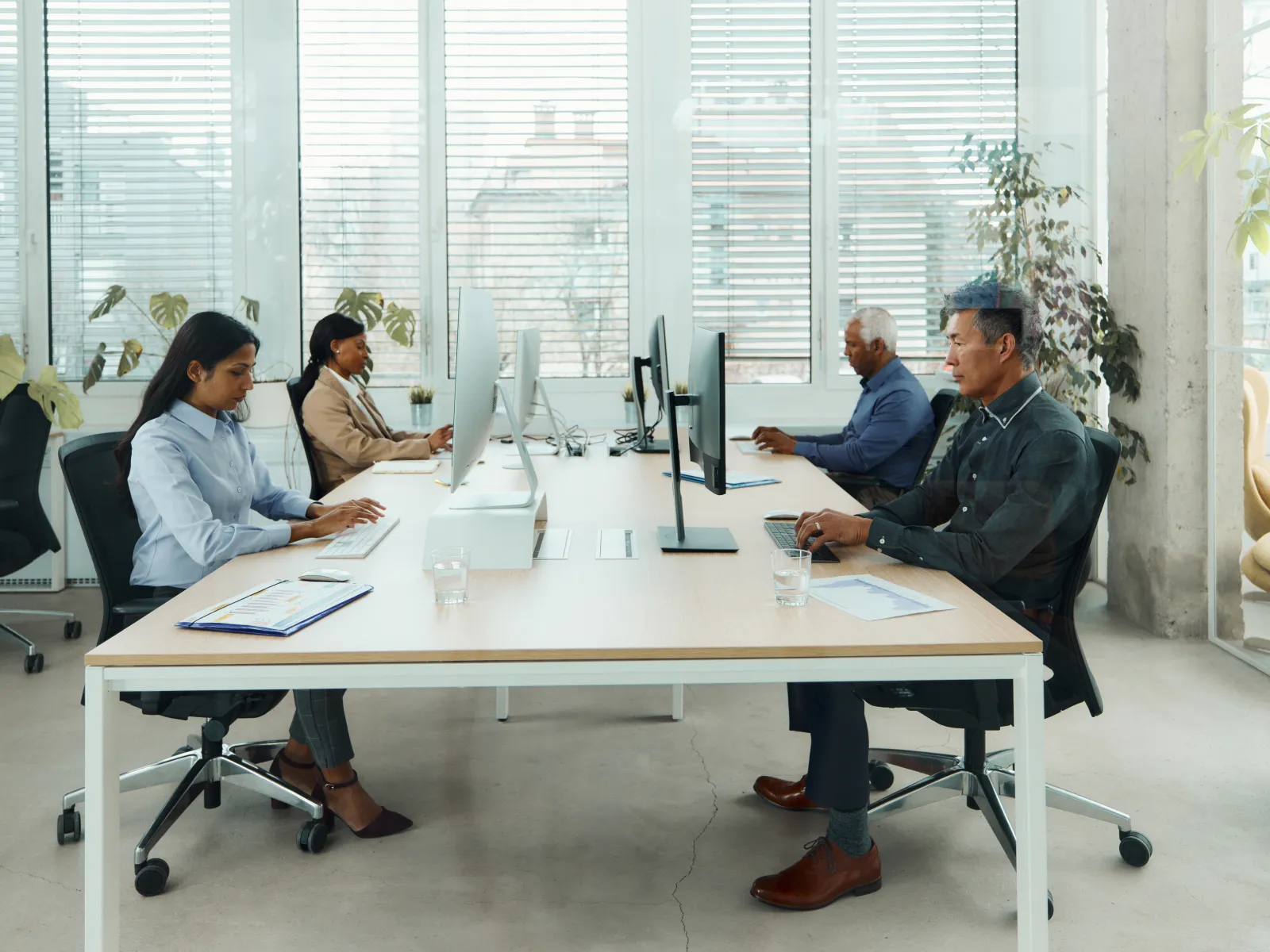 a group of people sitting around a table