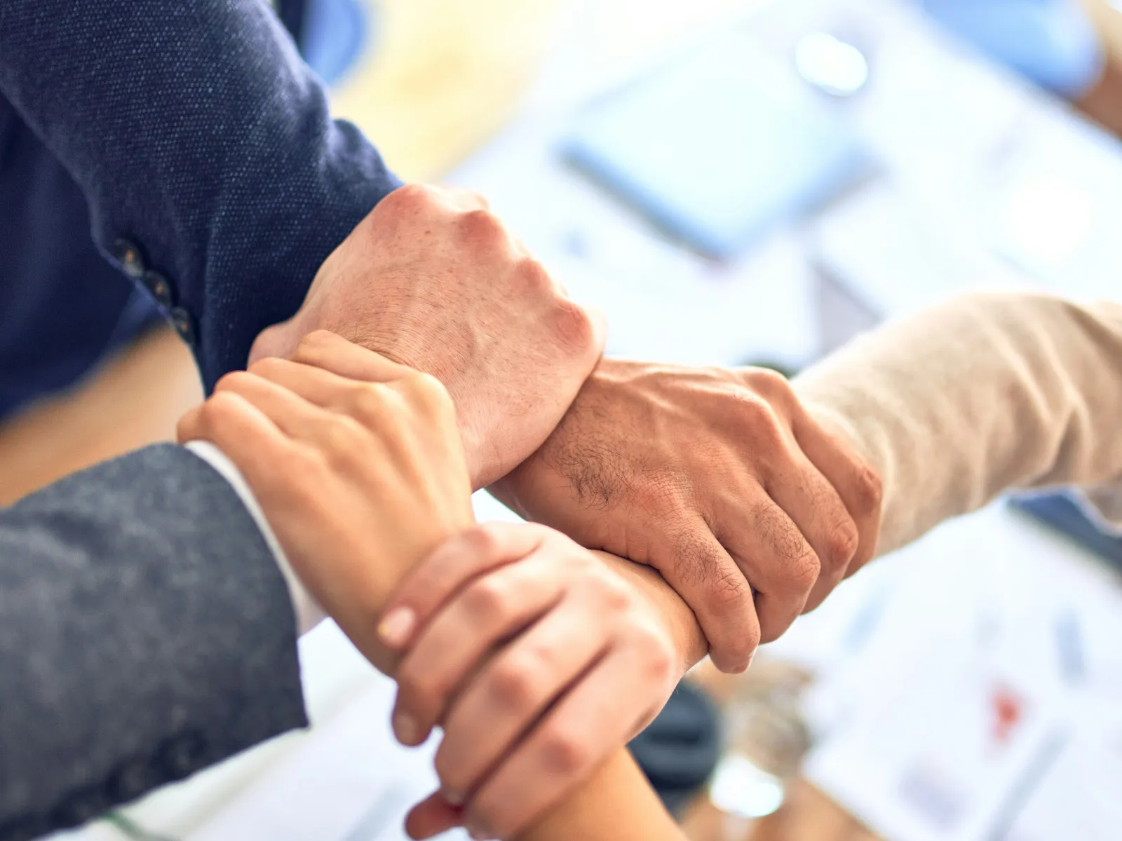 close-up of people shaking hands