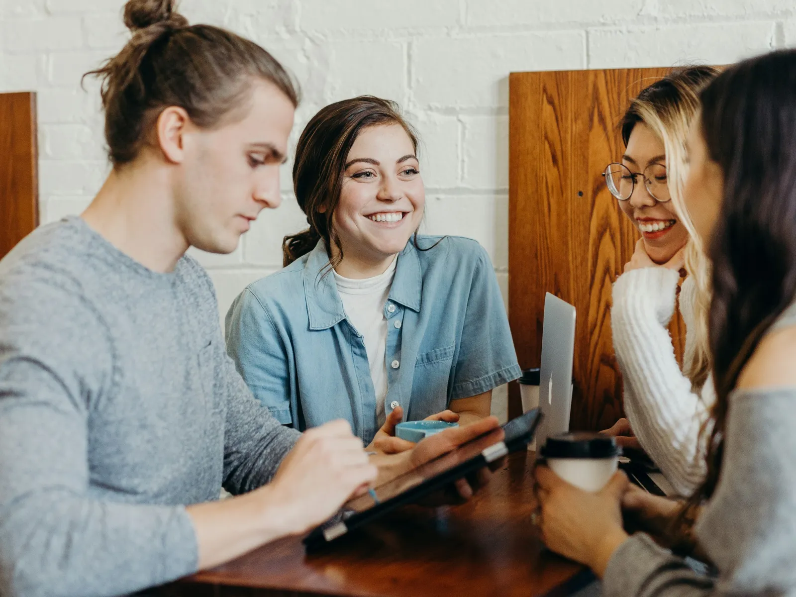 a group of women sitting at a table