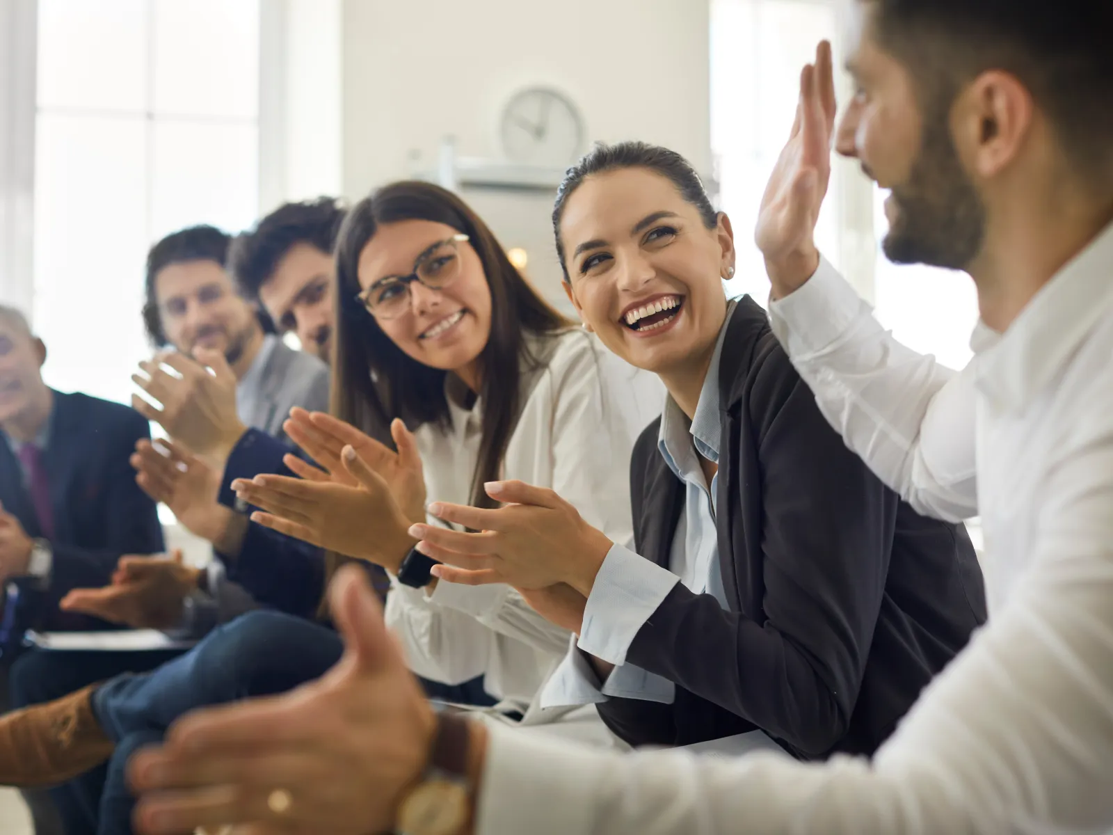 a group of people clapping