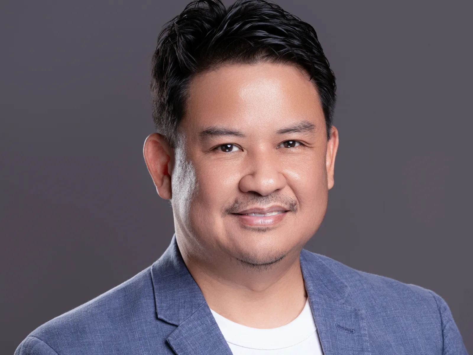 a man in a blue shirt