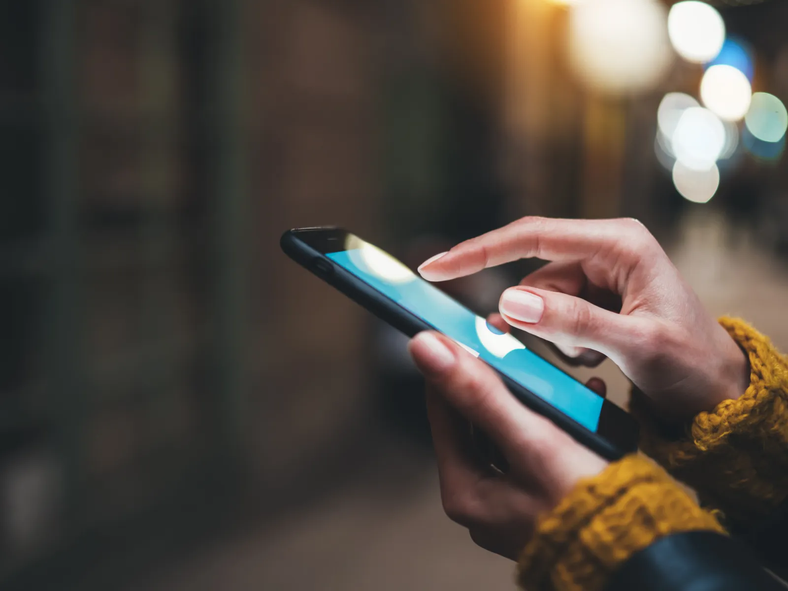 a person holds a cell phone