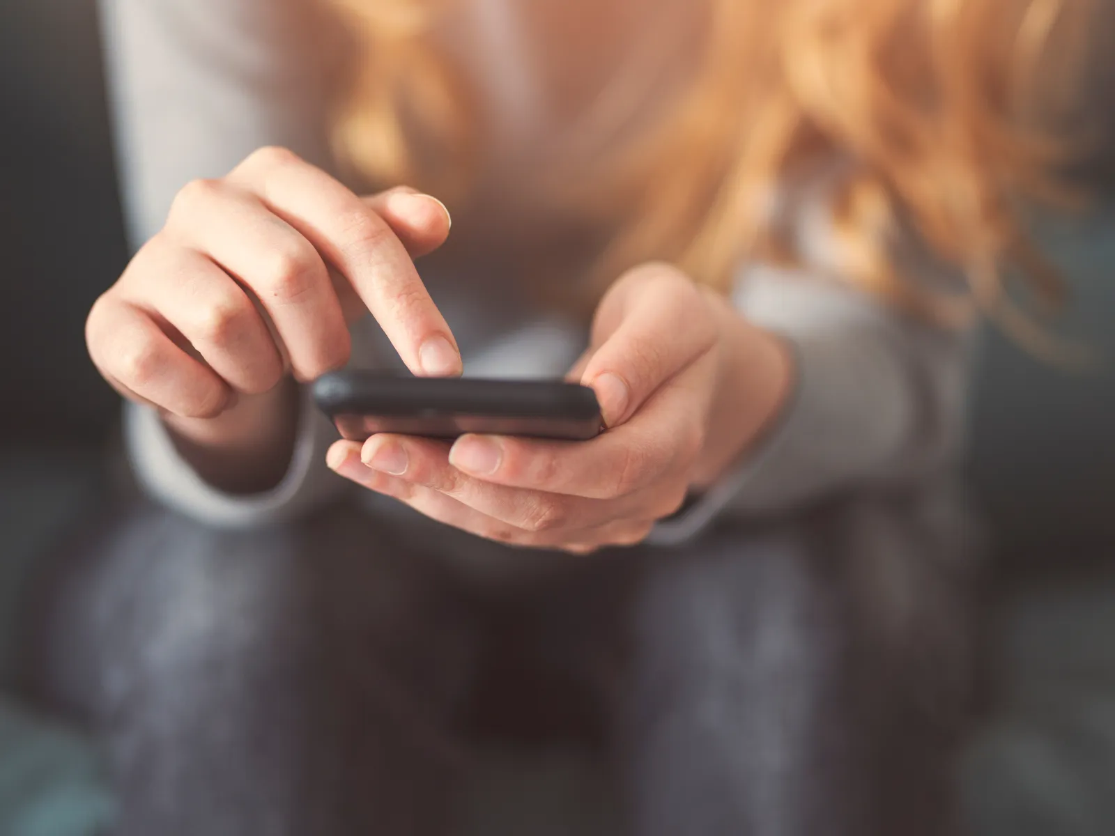 a woman holding a phone