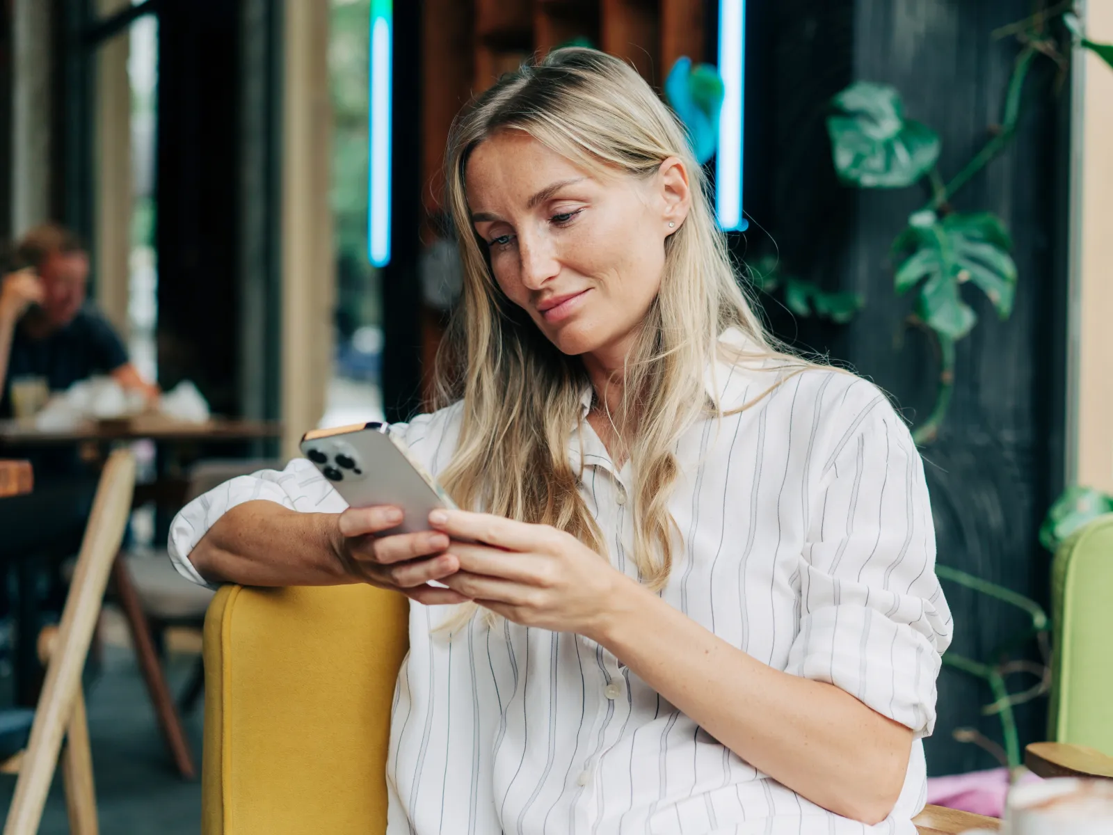 a woman looking at a phone