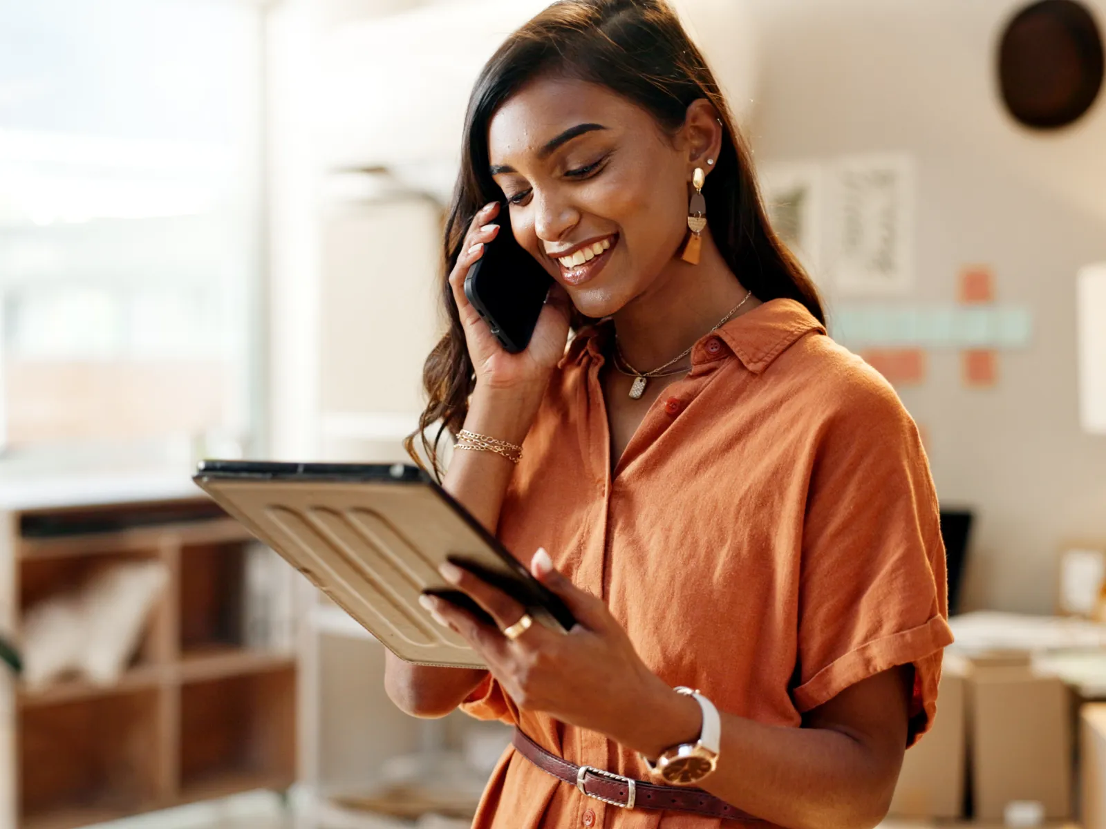 a woman holding a tablet