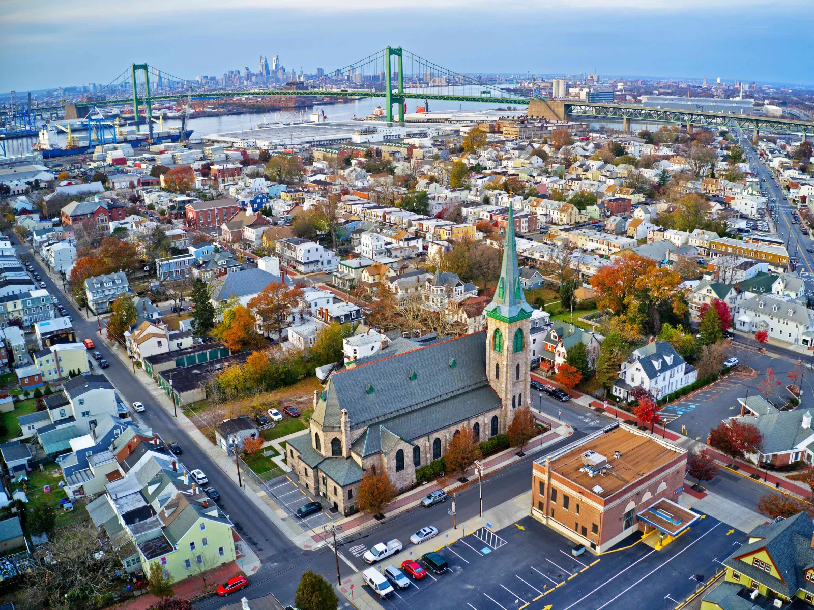 a city with a tower and a bridge in the background