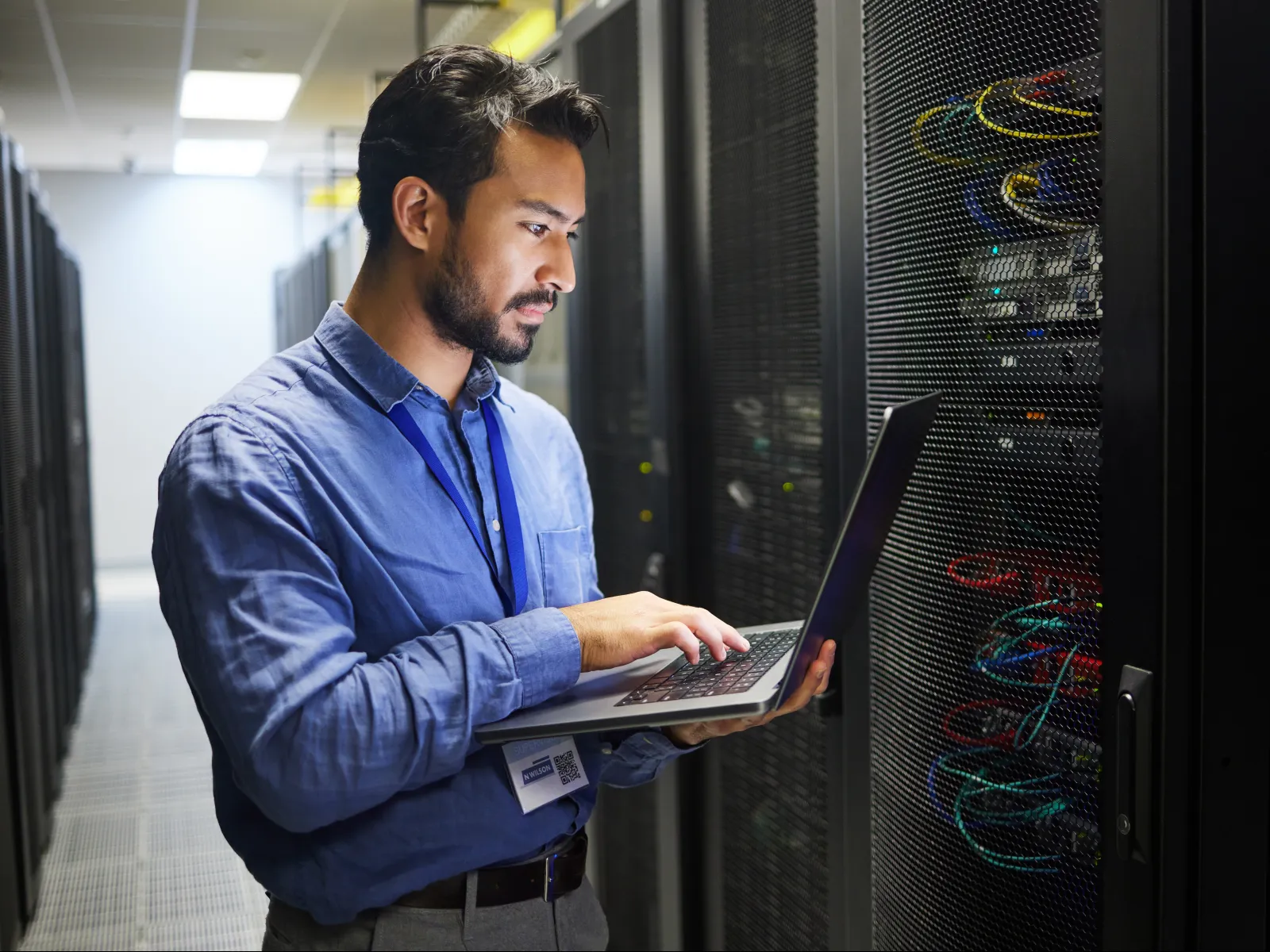 a man holding a laptop