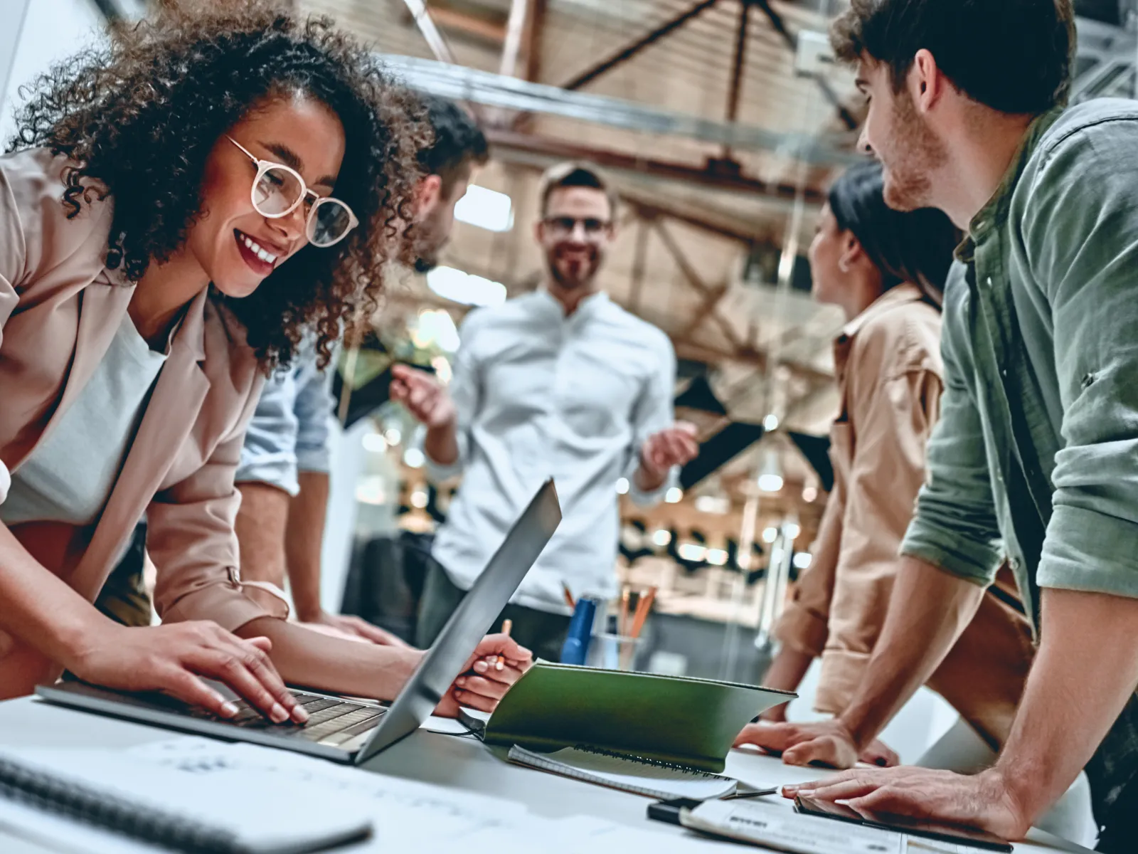 a group of people working on a computer
