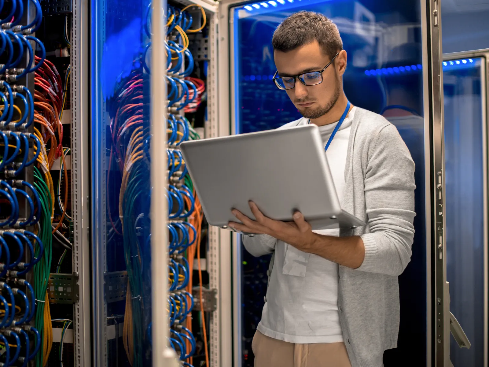 a man holding a laptop