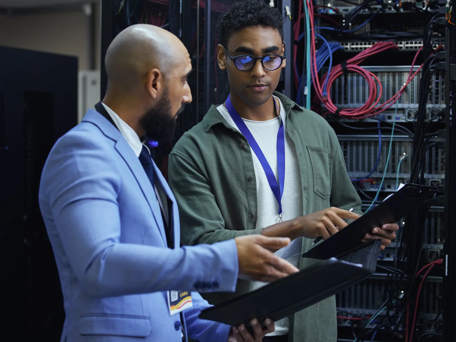 a person showing a person something on the computer