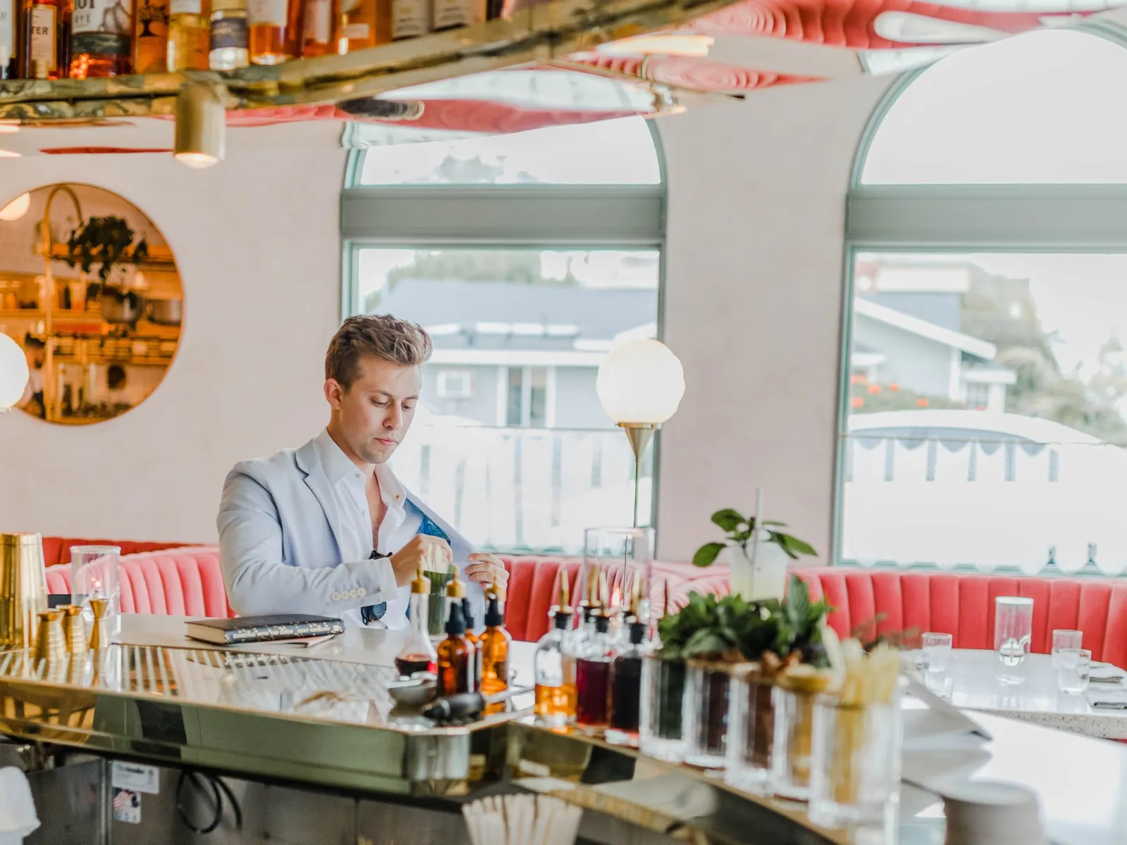 a person sitting at a table in a restaurant