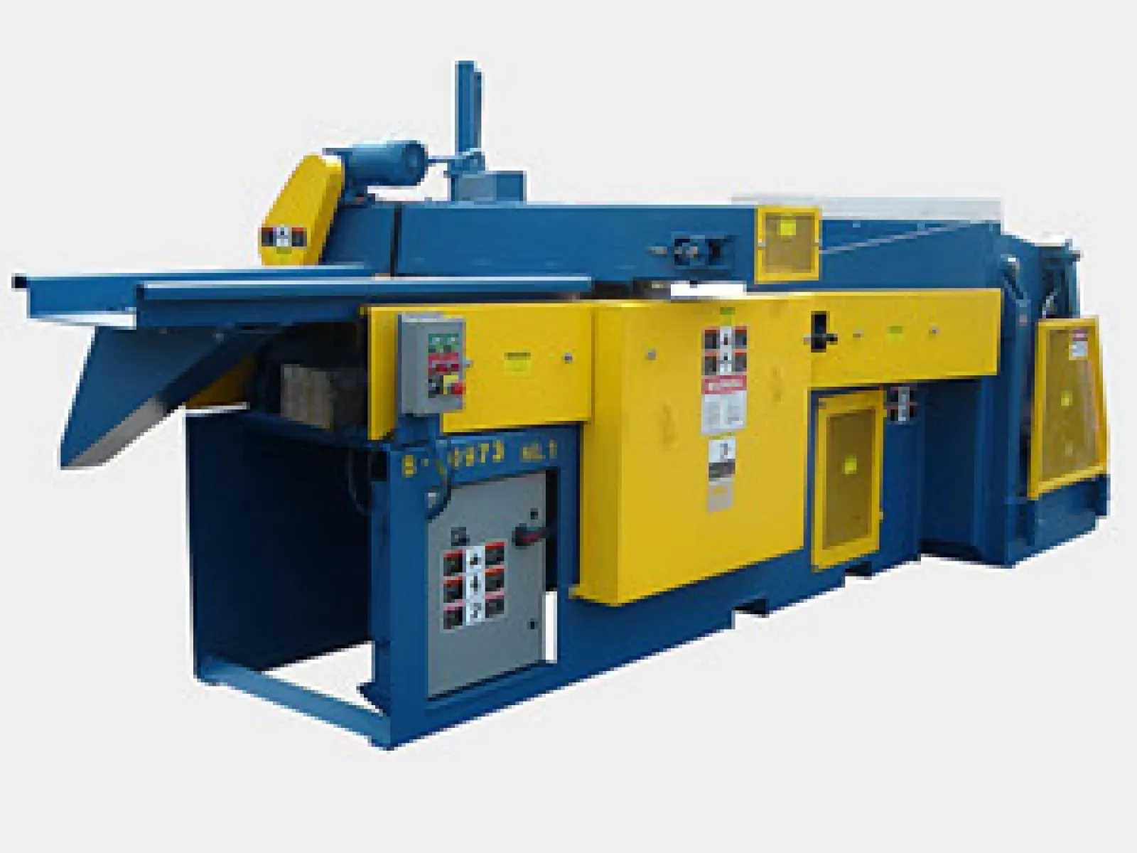Industrial blue and yellow heavy-duty metalworking machine with control panels and safety covers.