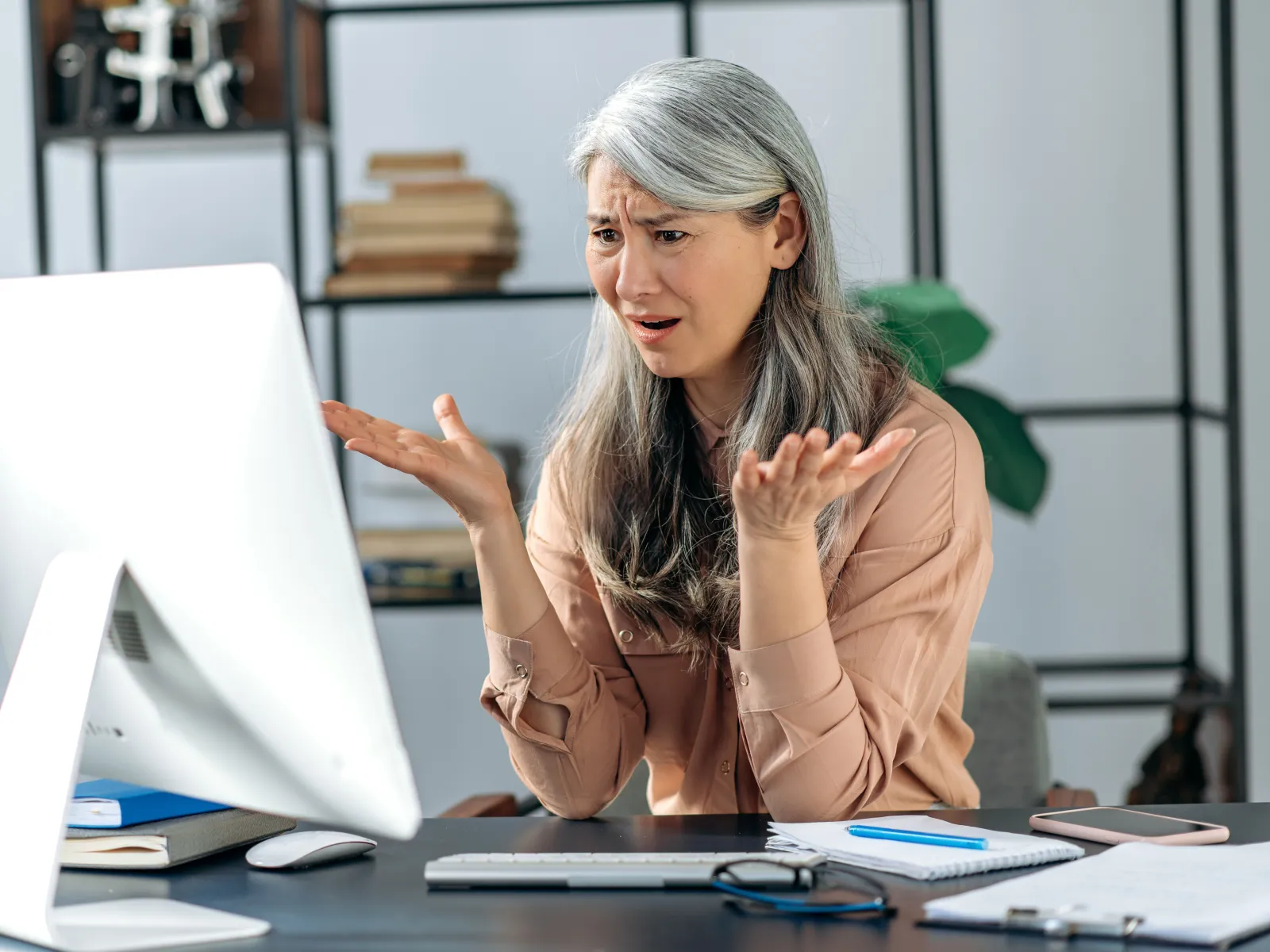 a woman sitting at a desk