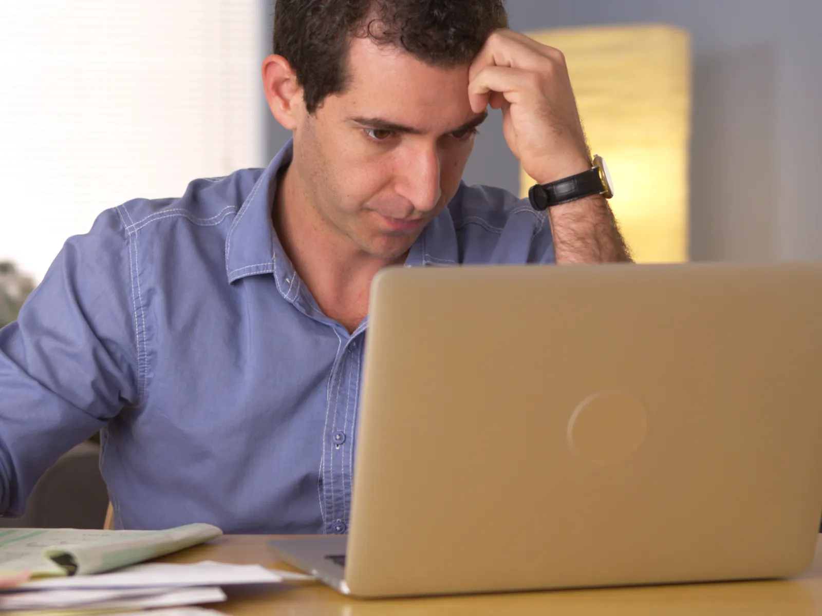 a man looking at a laptop