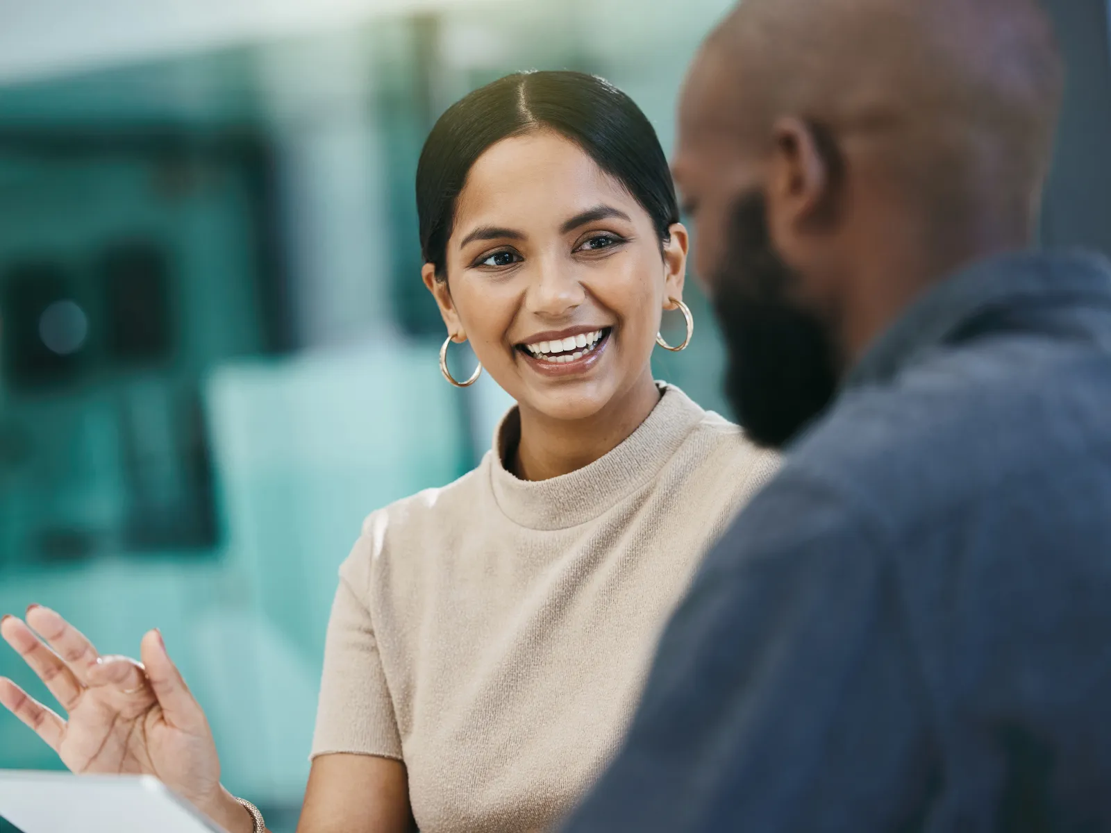 a woman smiling at a man