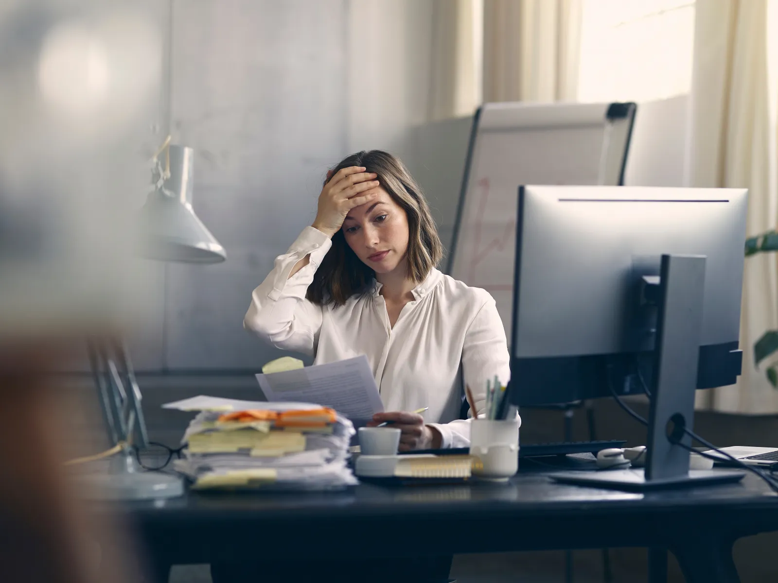 a woman sitting at a desk