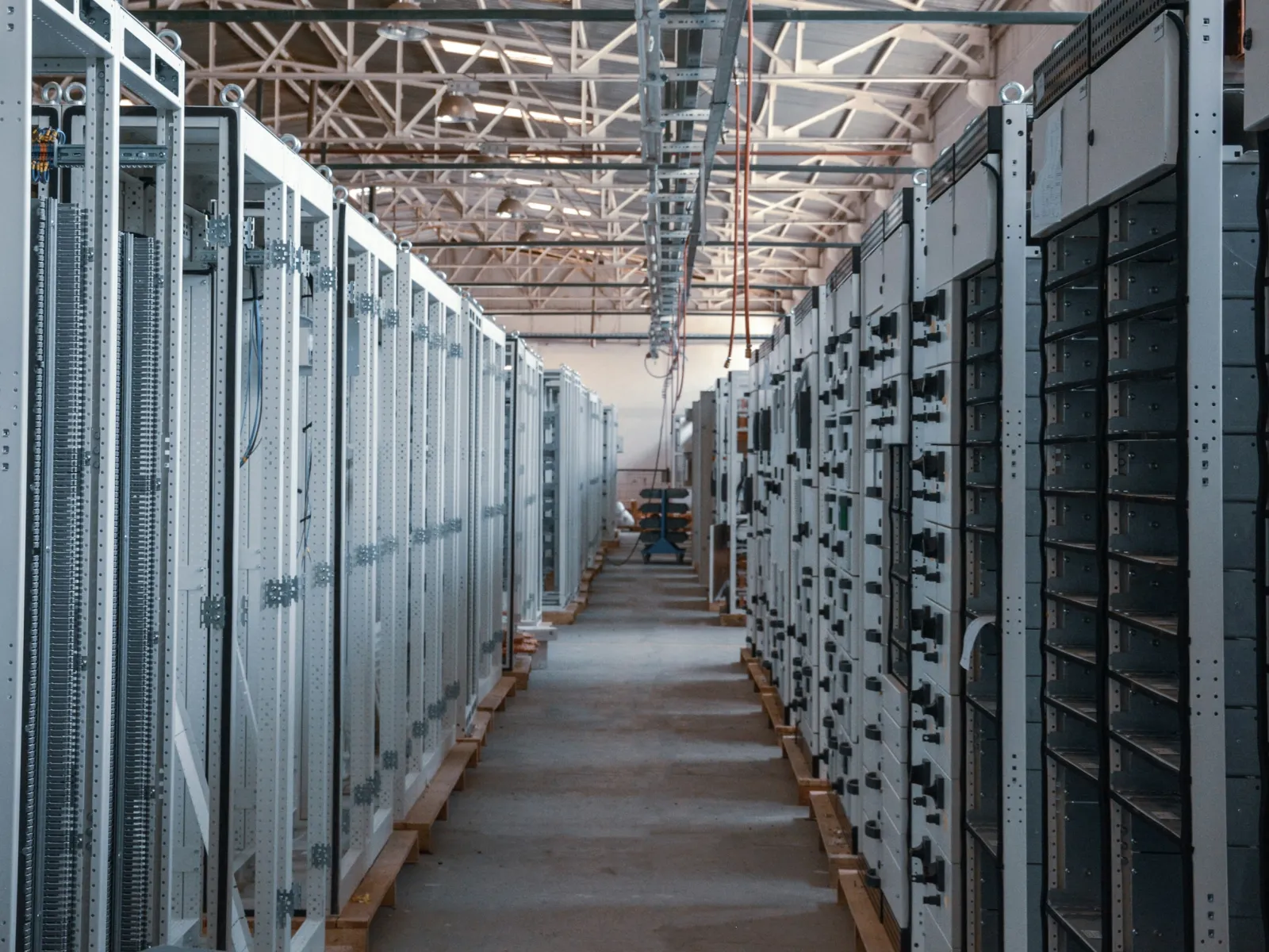a long hallway with rows of computer servers