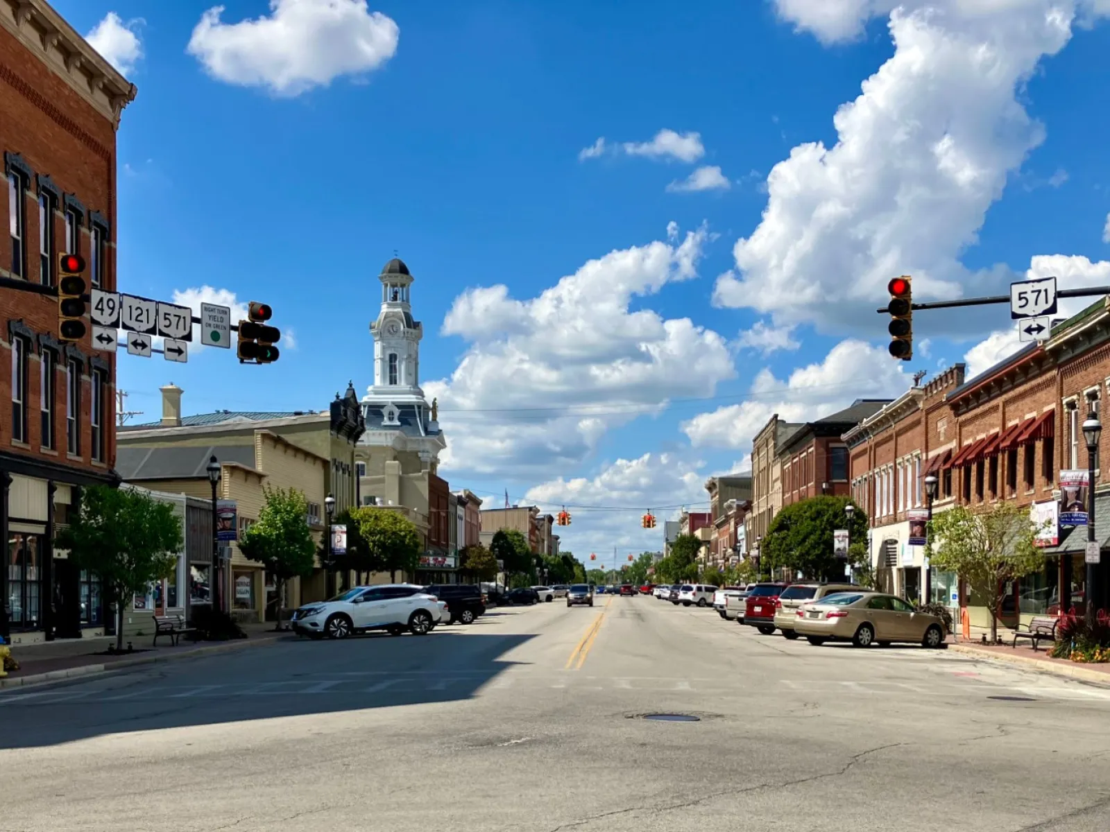 a street with cars and buildings