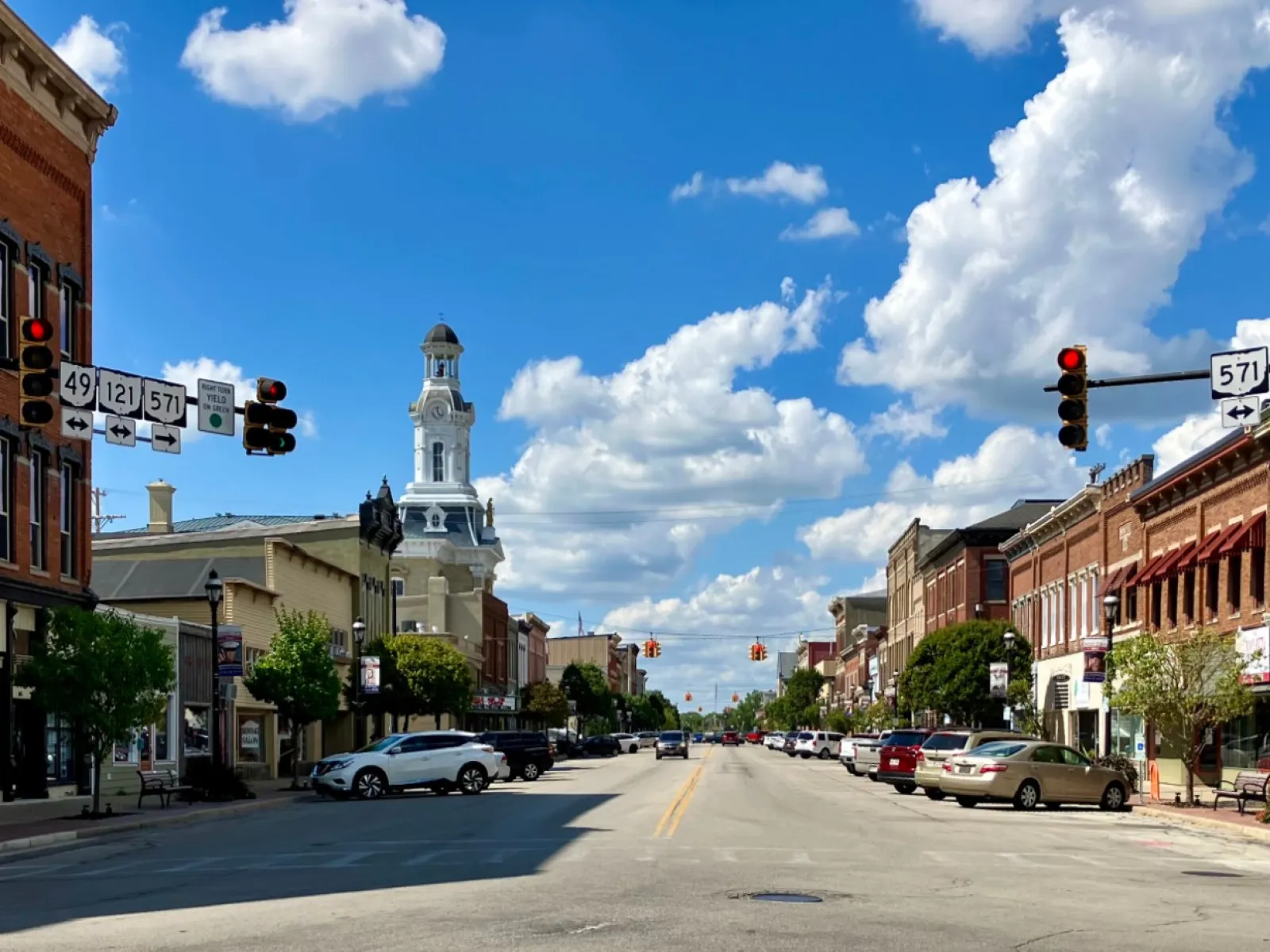 a street with cars and buildings