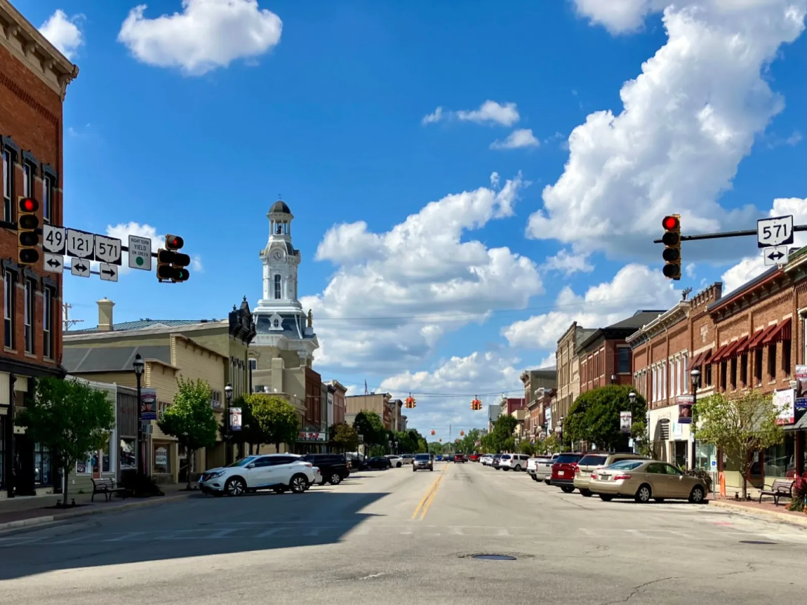a street with cars and buildings