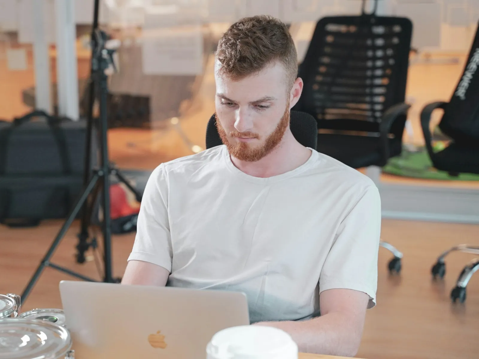 a person sitting at a table with a laptop