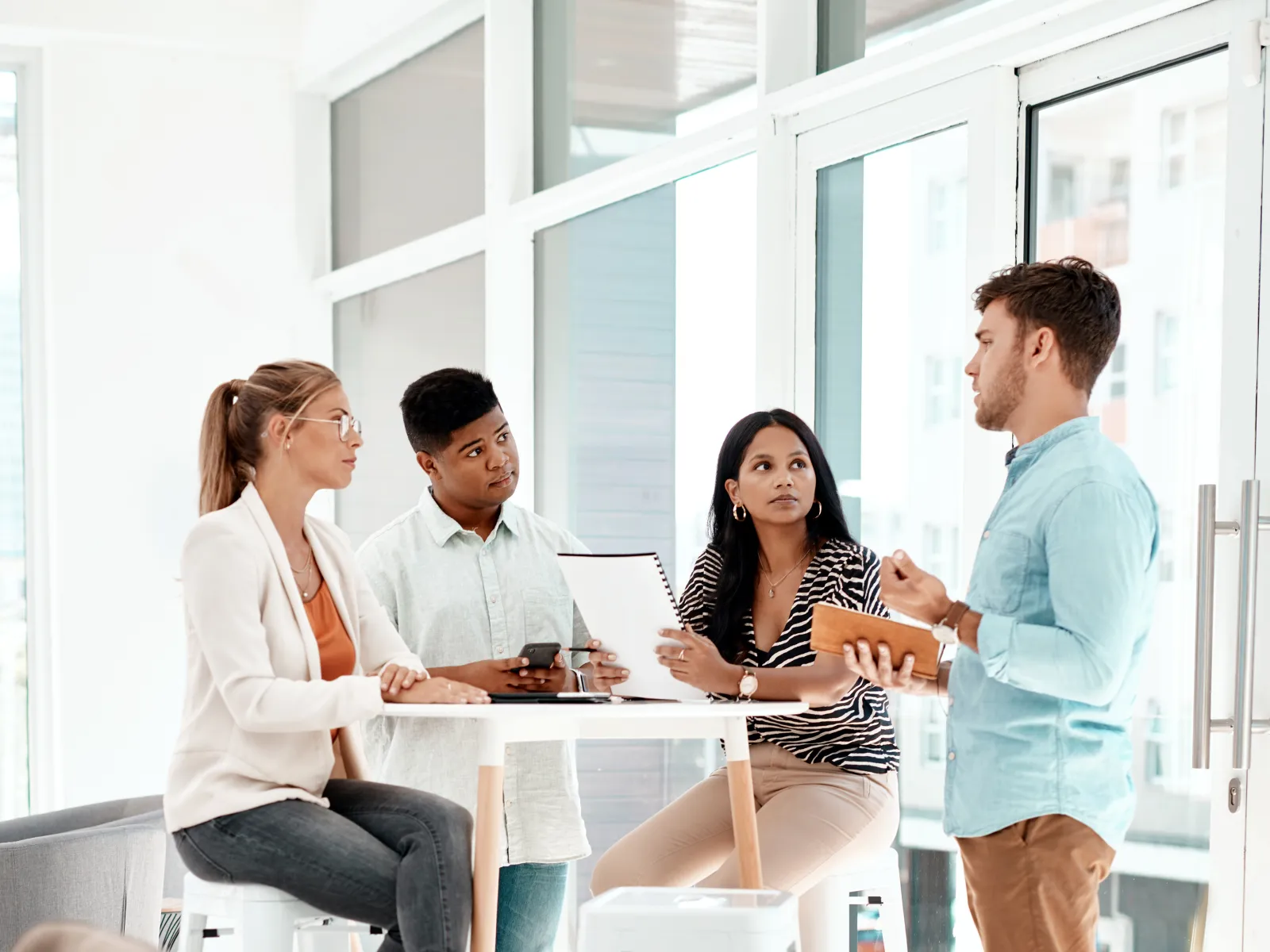 a group of people sitting around a table