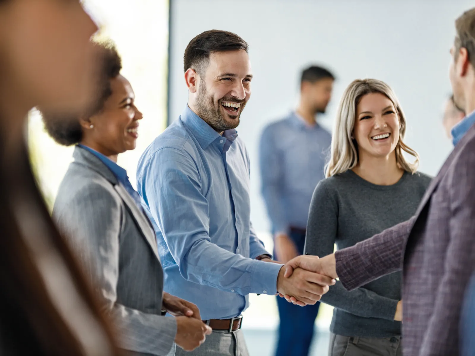 a group of people shaking hands