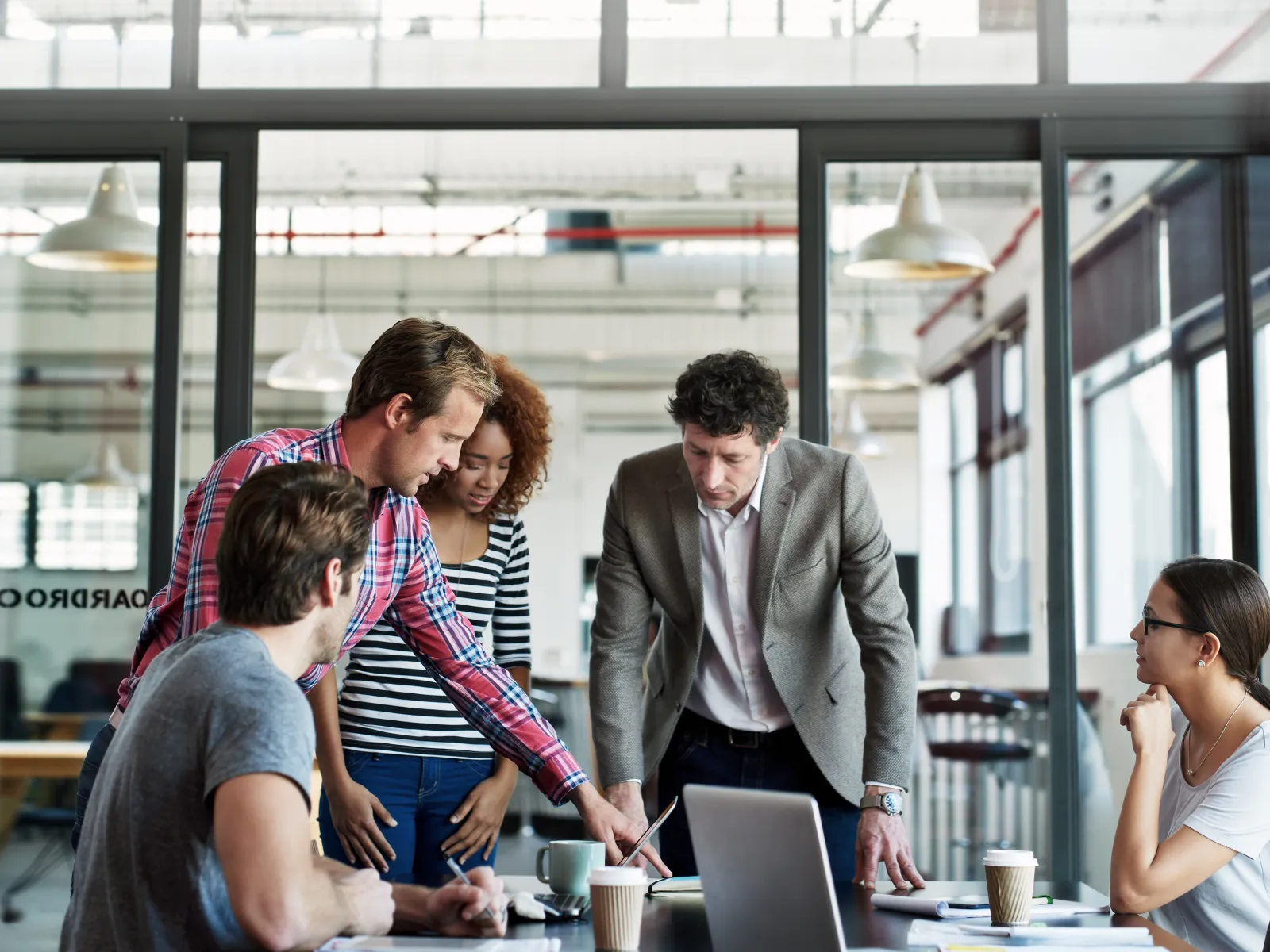 a group of people in a meeting