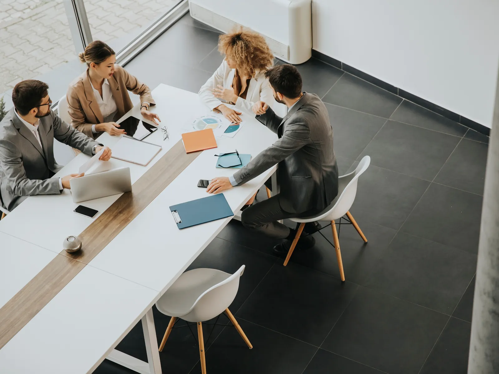 a group of people sitting around a table