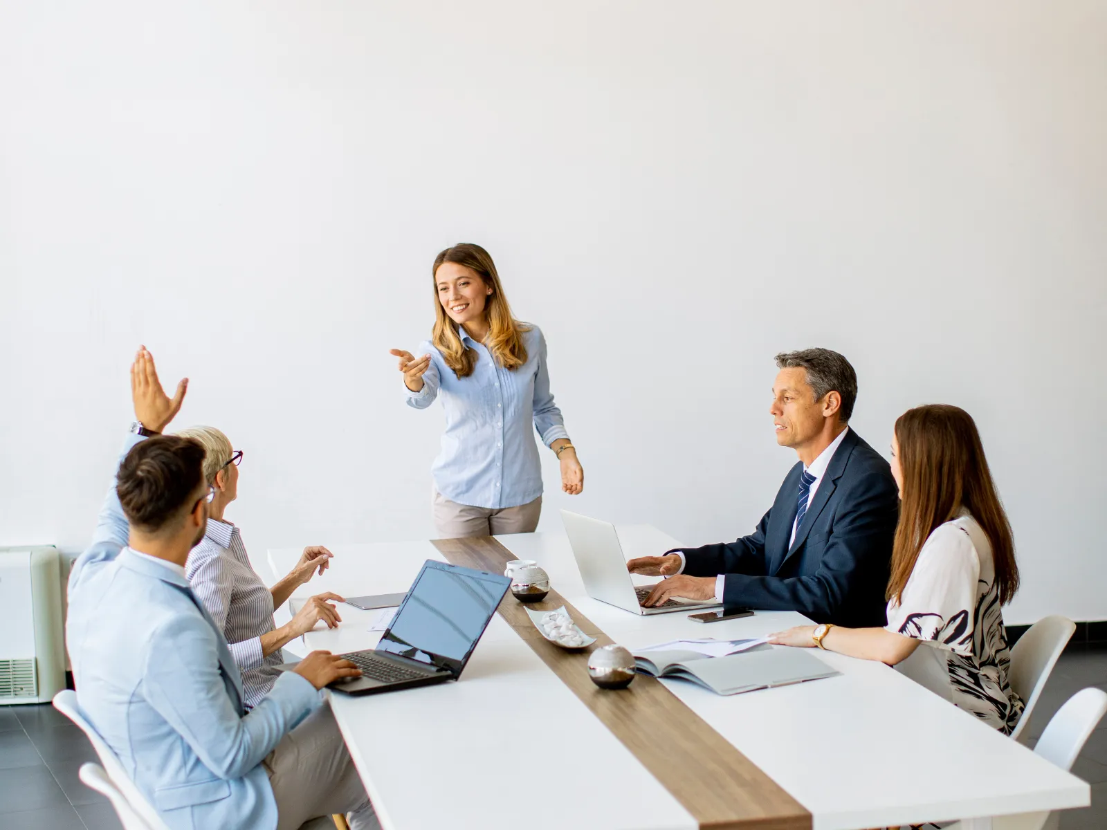 a group of people sitting around a table