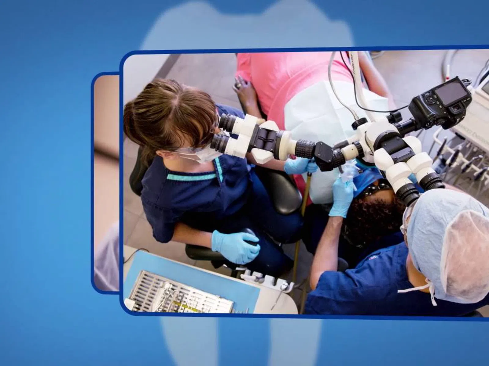 Dentists using a dental microscope to examine a patient's teeth during a procedure in a clinical setting.