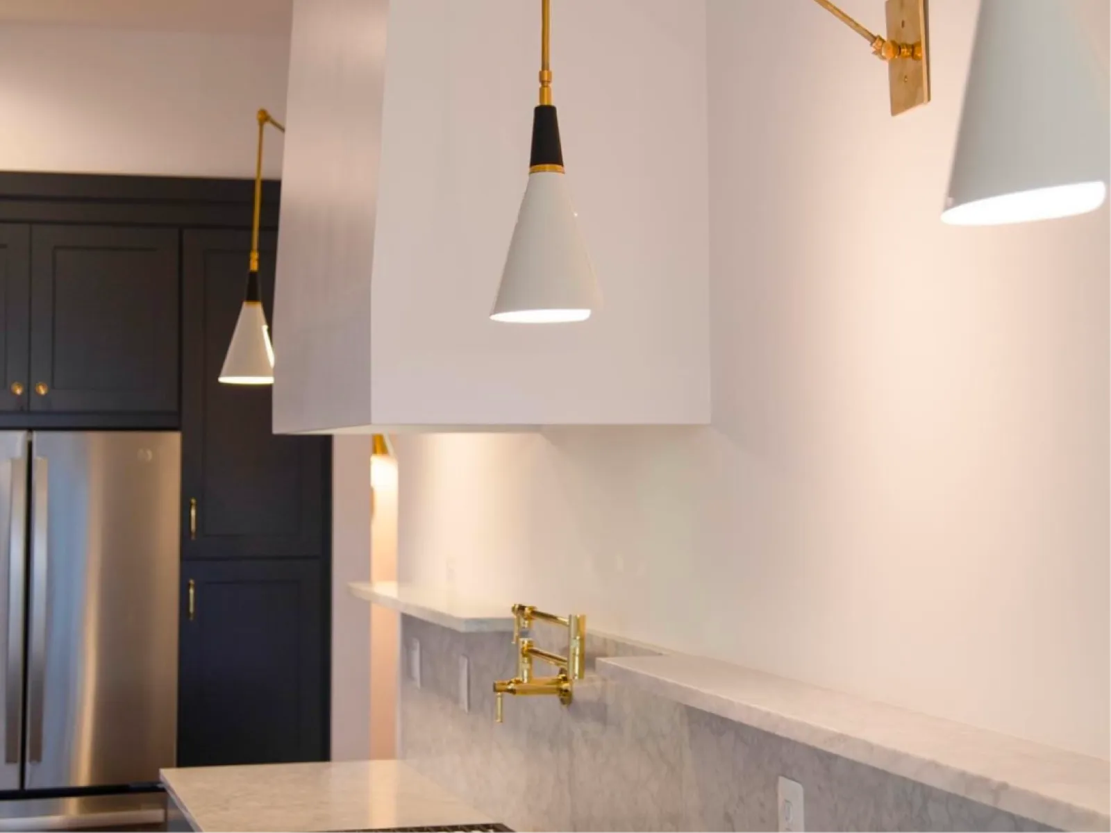 a kitchen with a bar and a bar stool