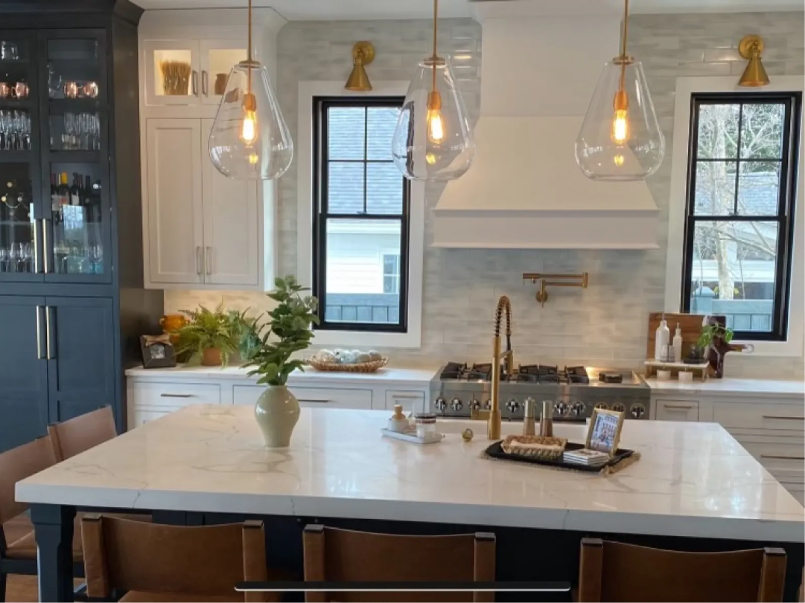 a kitchen with a large white table