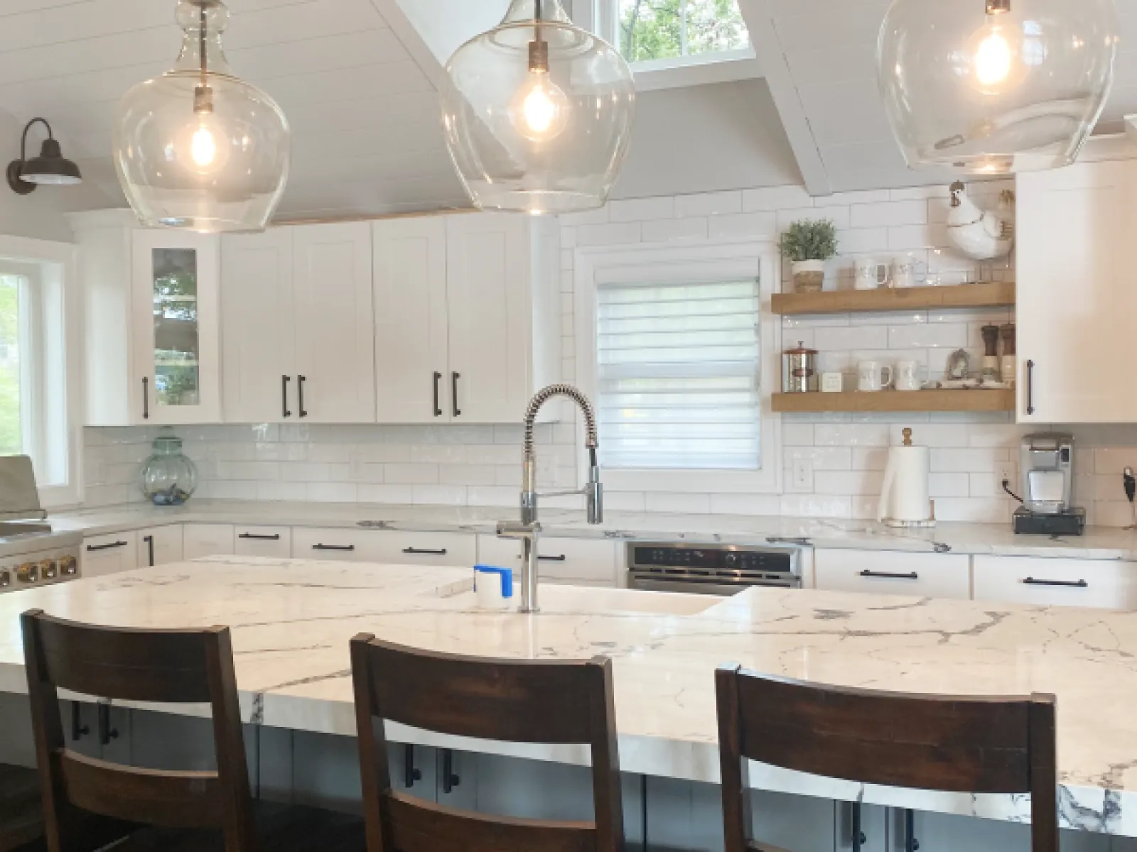 a kitchen with white cabinets