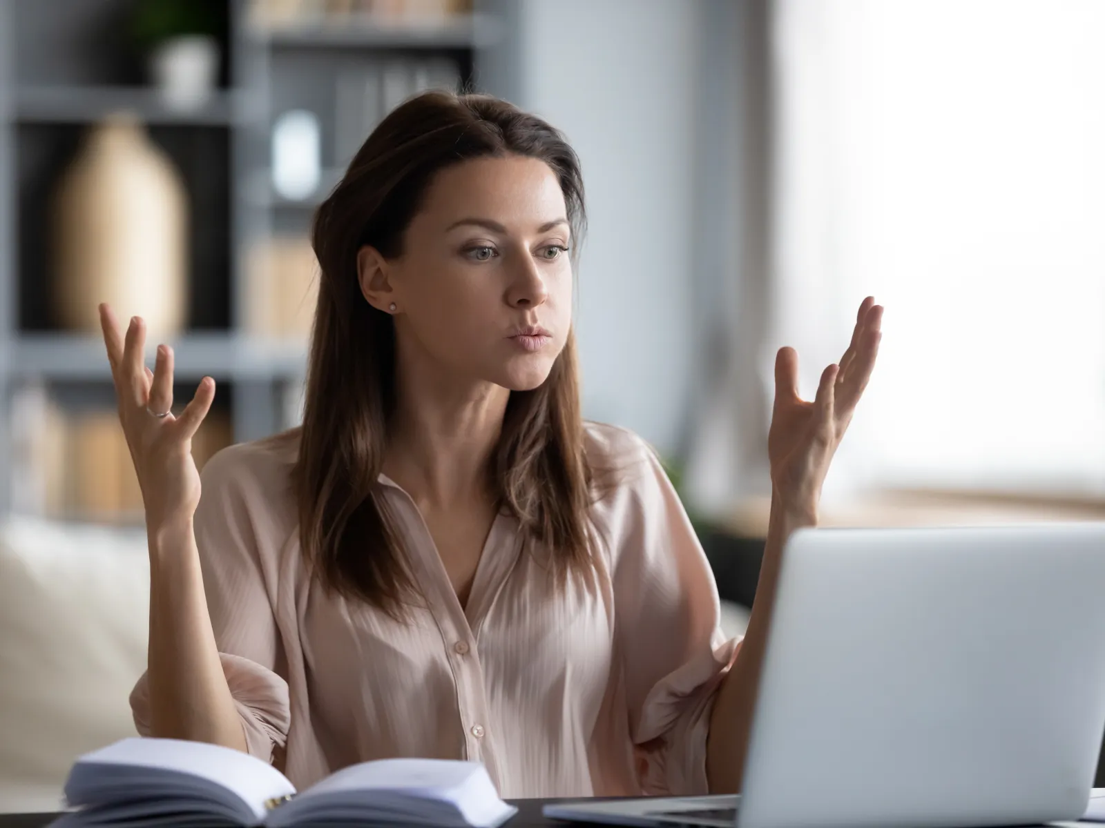 A woman sitting in front of a laptop