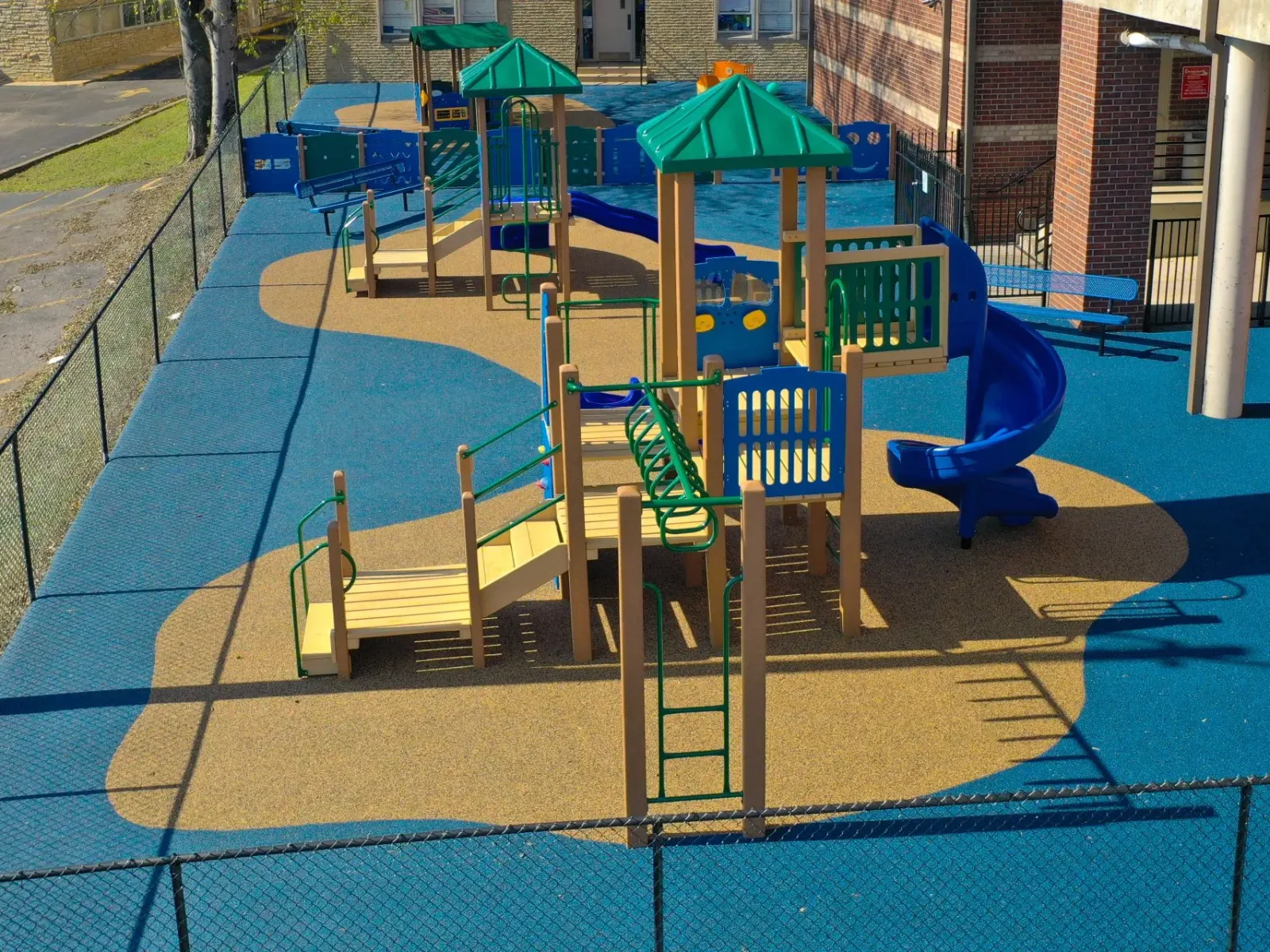a playground with blue chairs