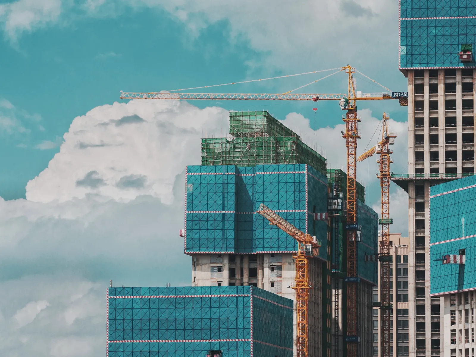 a construction site with cranes