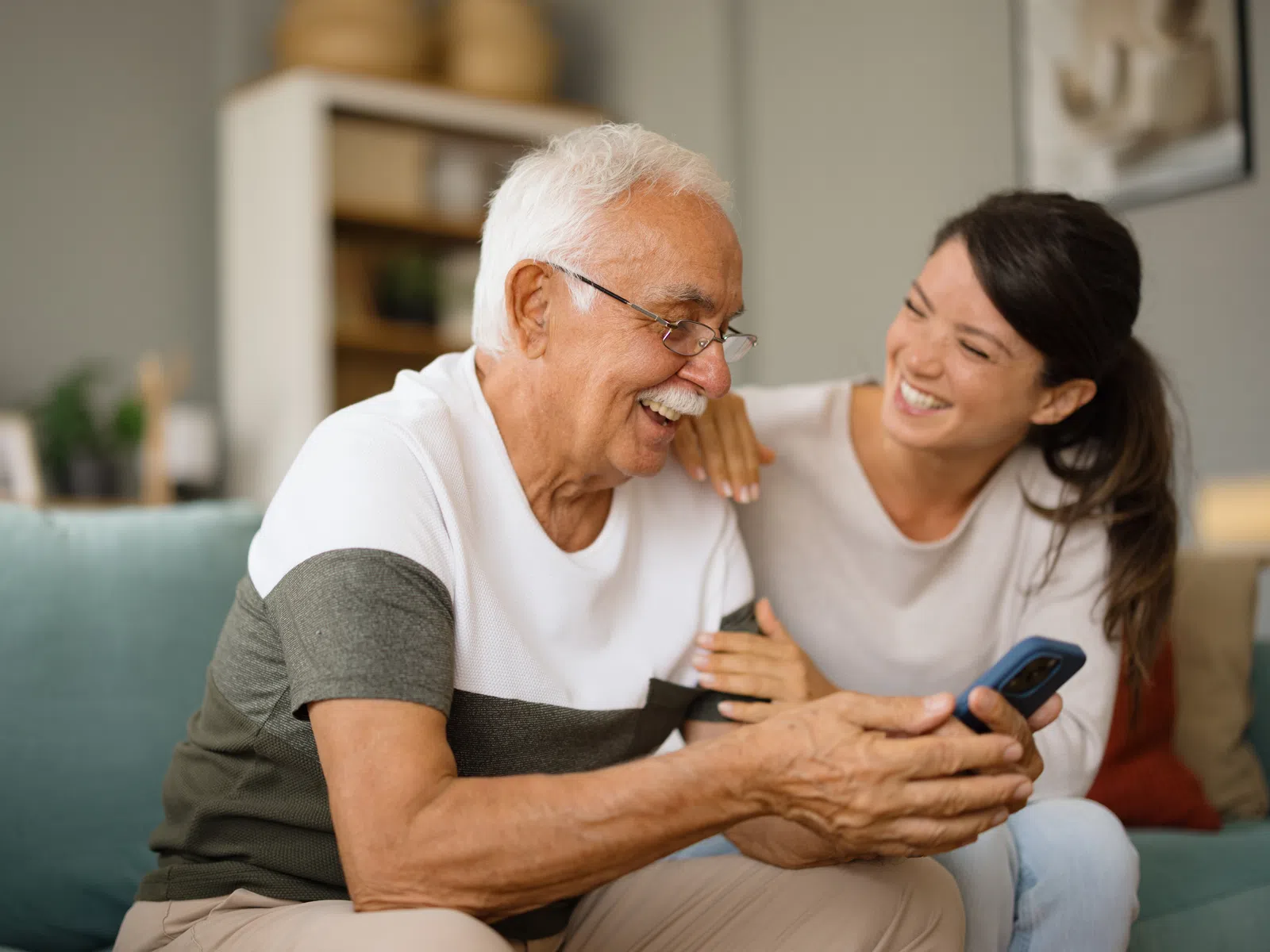 Adult daughter laughing with her father