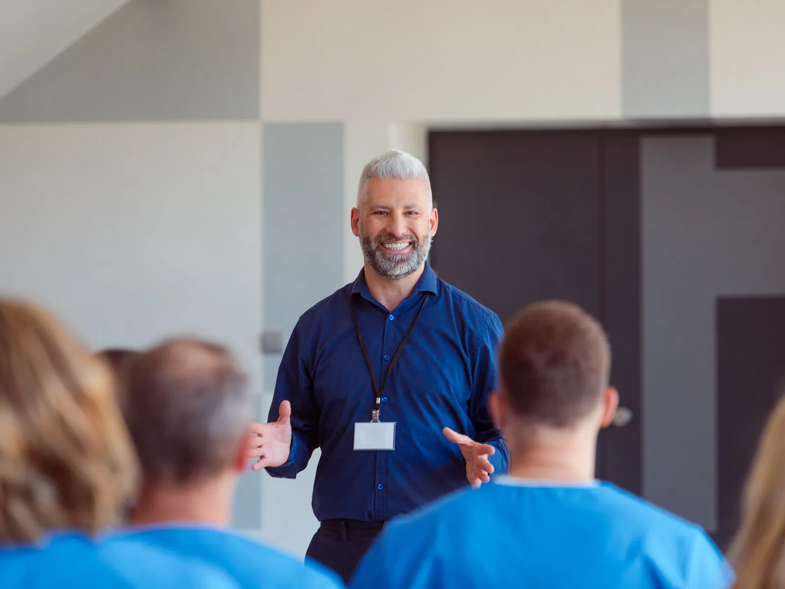 Presenter speaking to healthcare staff during a training session
