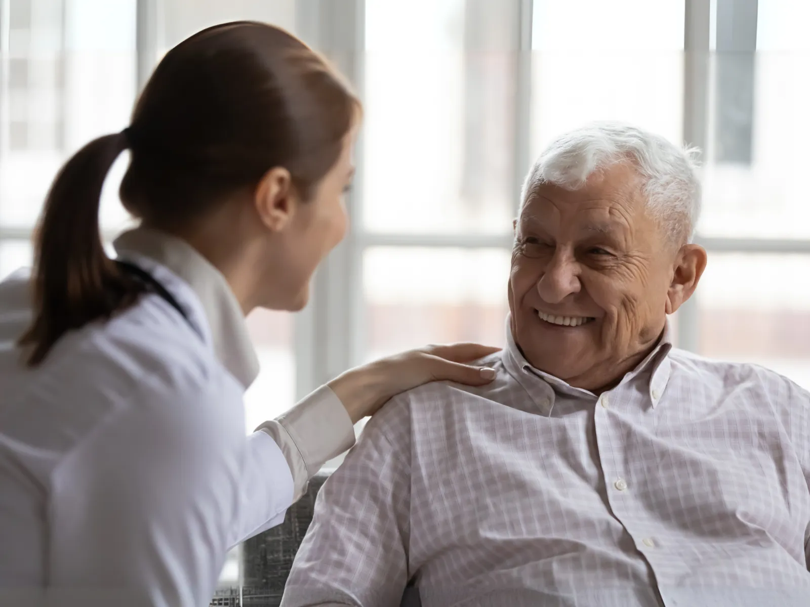 a doctor showing a patient something on the phone