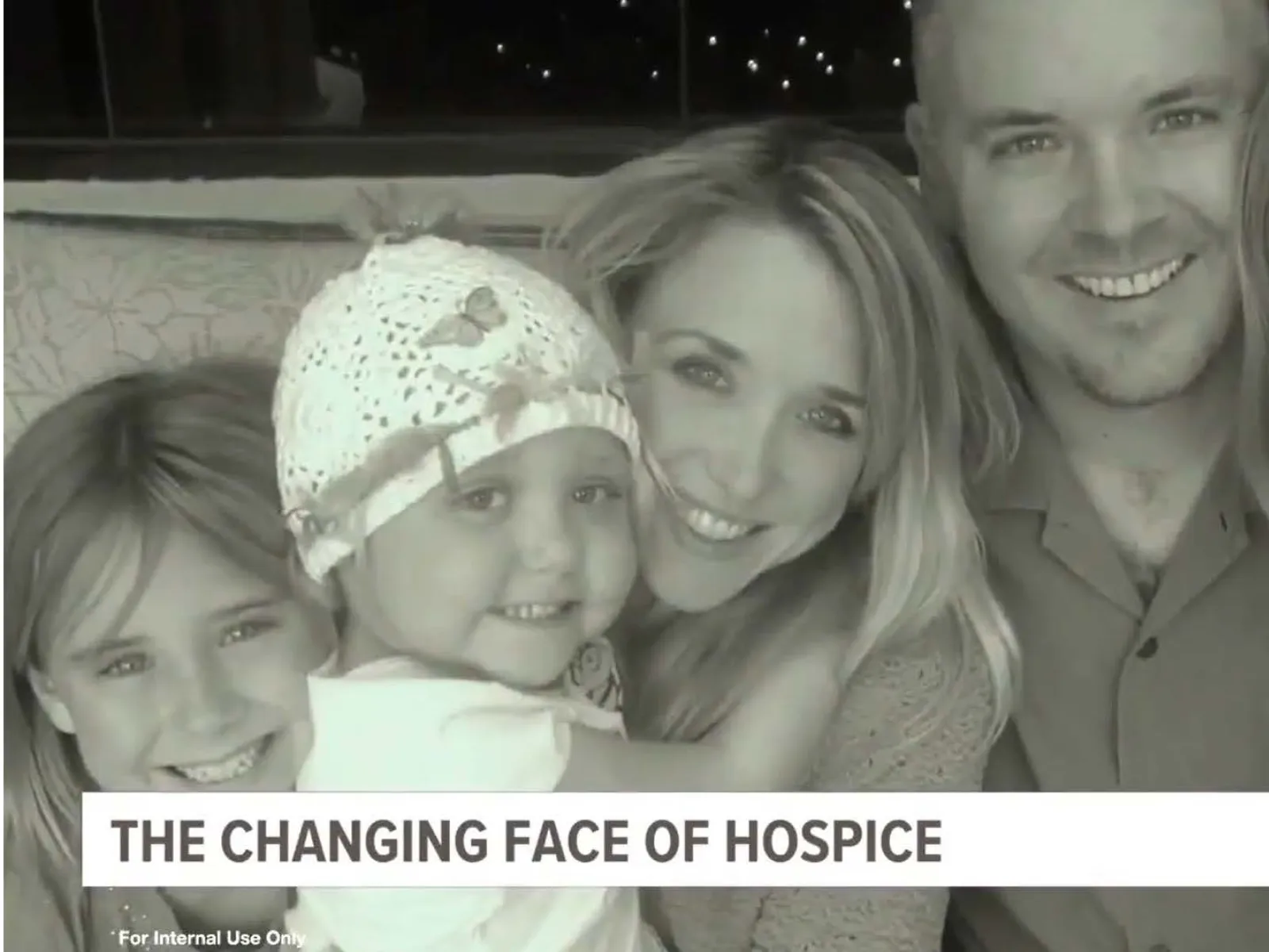 Smiling family of five embracing, representing the changing face of hospice care in a heartfelt moment.