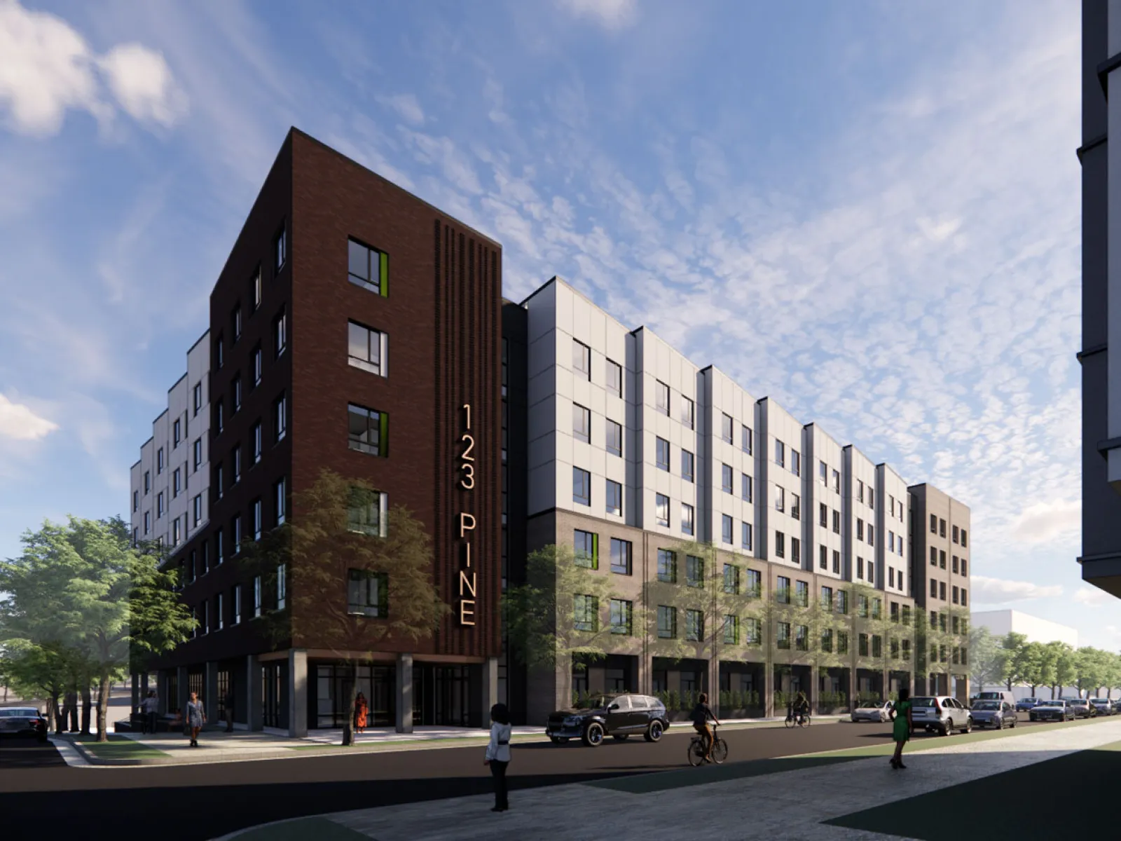 Modern mixed-use building with dark and light facades on a sunny street corner, labeled 123 Pine.