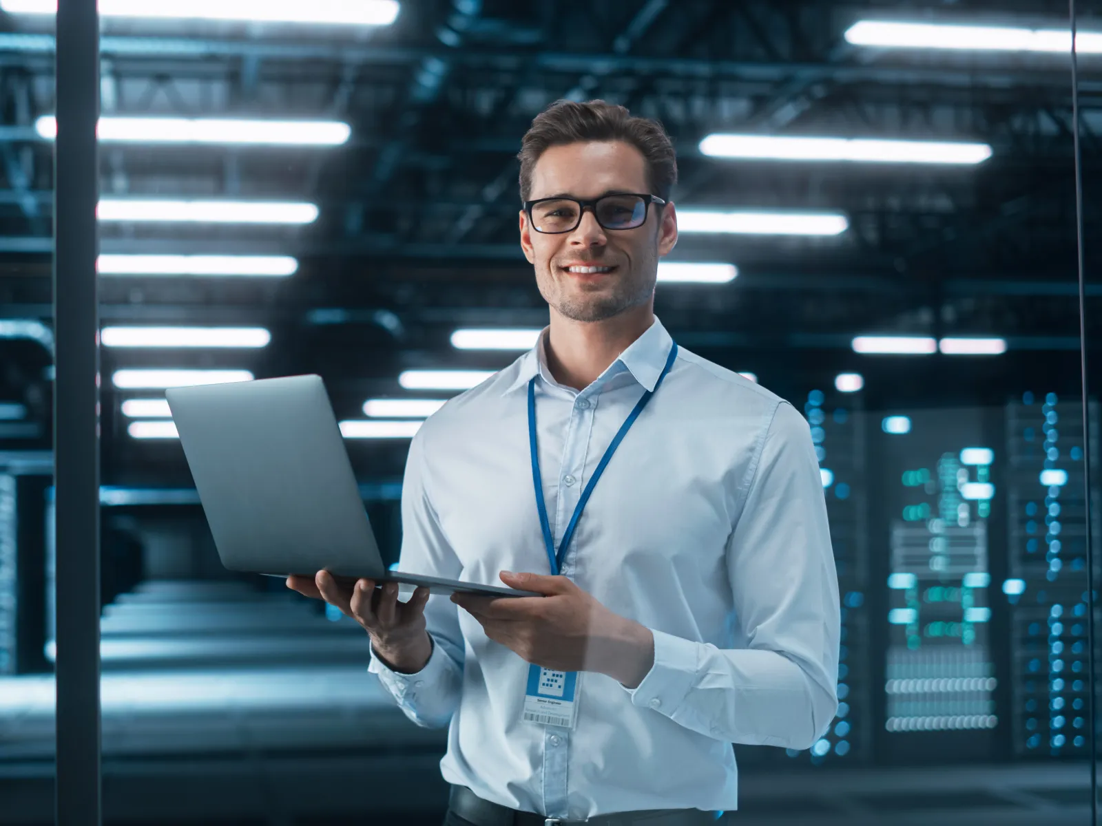 a man holding a laptop