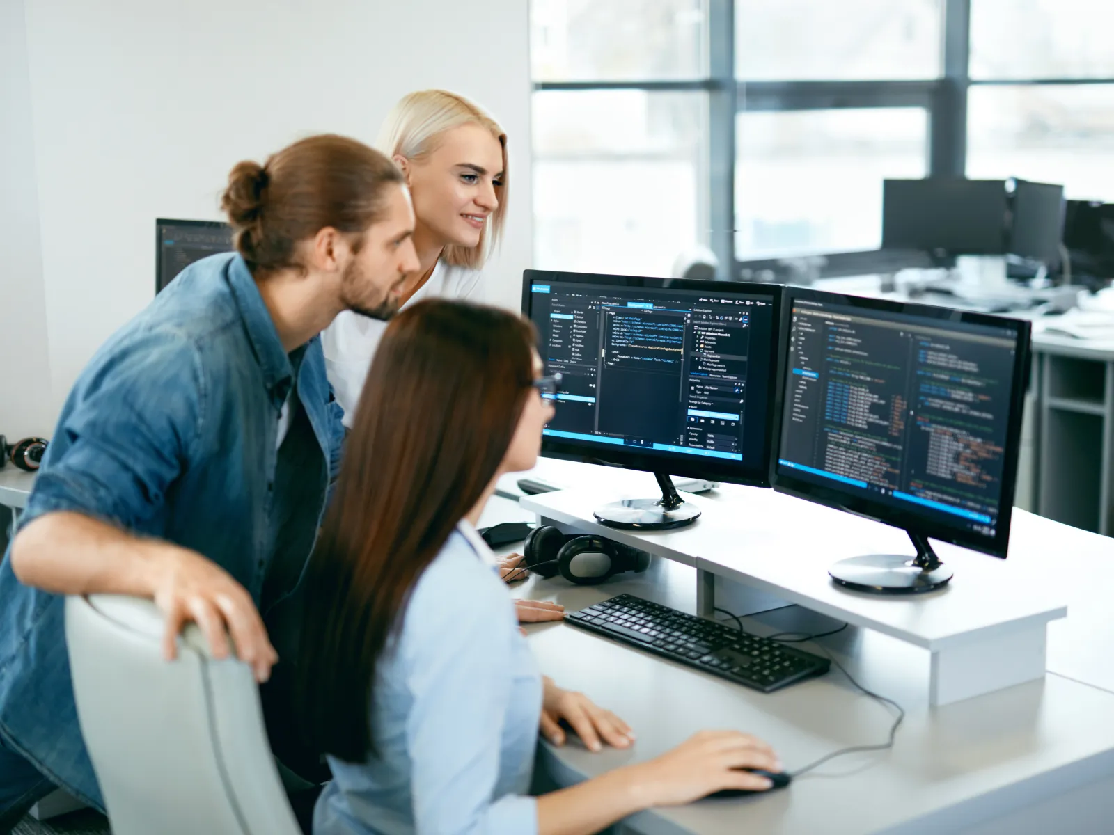 a few people working at a computer