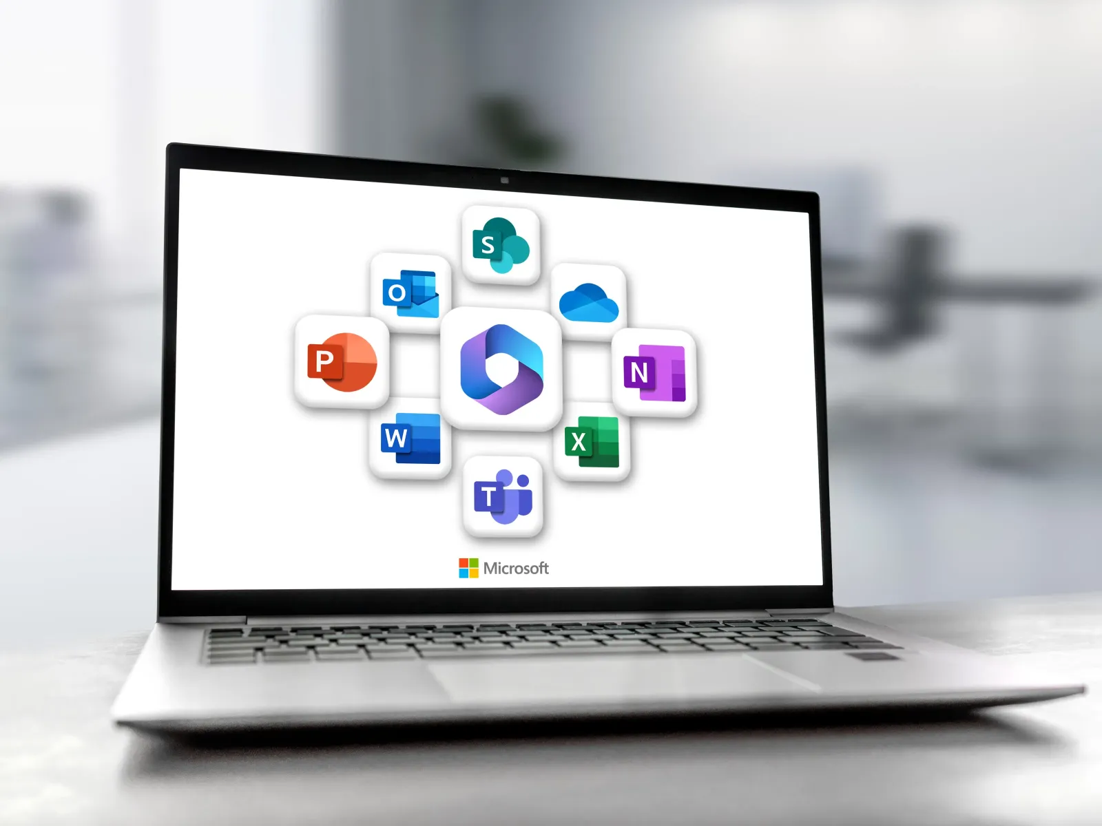 Laptop screen displaying Microsoft 365 app icons including Word, Excel, PowerPoint, Outlook, Teams, OneDrive, and OneNote.