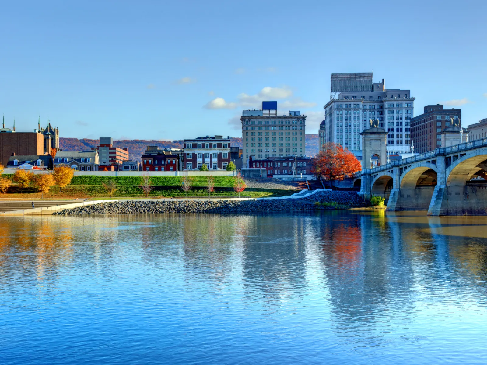 a body of water with buildings in the background